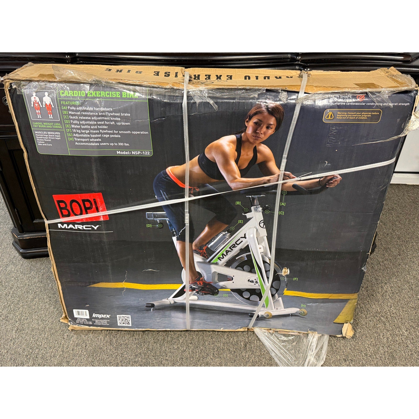 Marcy Club Deluxe Revolution Cycle indoor exercise bike with adjustable seat, handlebars, and digital display for cardio workouts.