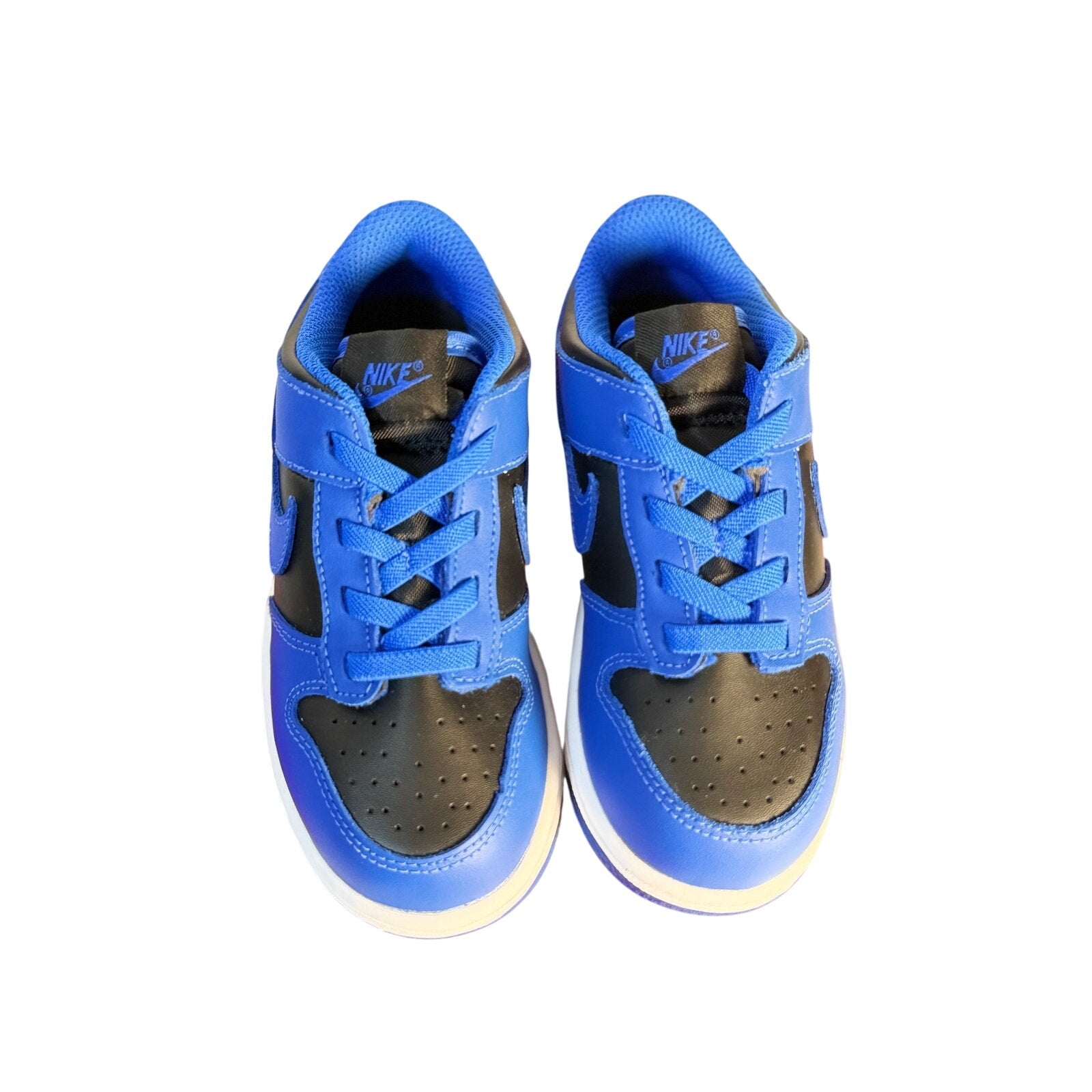 Nike Dunk Low GS Royal Blue and Black sneakers for kids, athletic shoes with blue and black design and Nike branding.