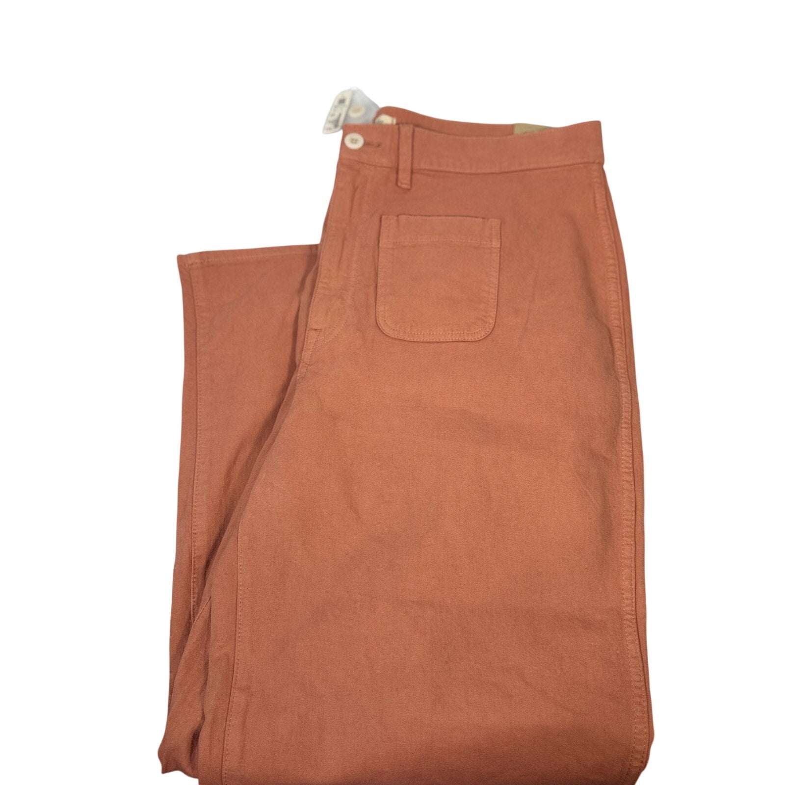 Madewell The Perfect Vintage wide-leg crop pants in terracotta, size 33, displayed flat with front pockets and cropped hem.