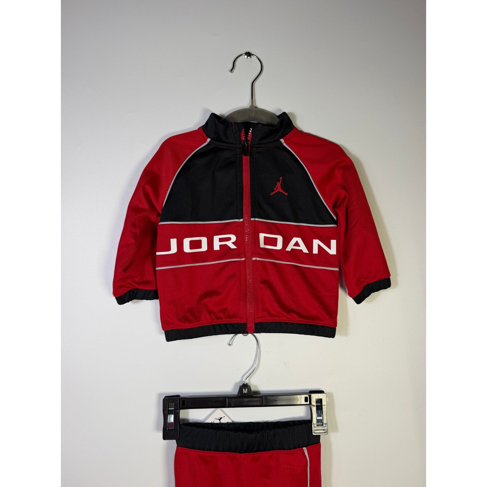 Jordan baby boys 2-piece tracksuit jacket and pants set in red and black, size 12 months, new with tags.