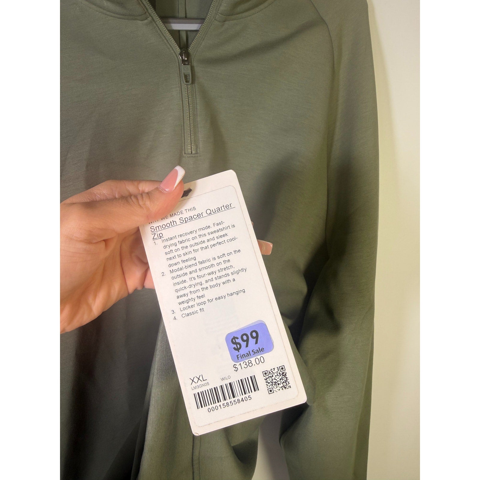 Men's green Lululemon Smooth Spacer Quarter Zip sweatshirt in XXL, showing the quarter zip collar and soft fabric texture.