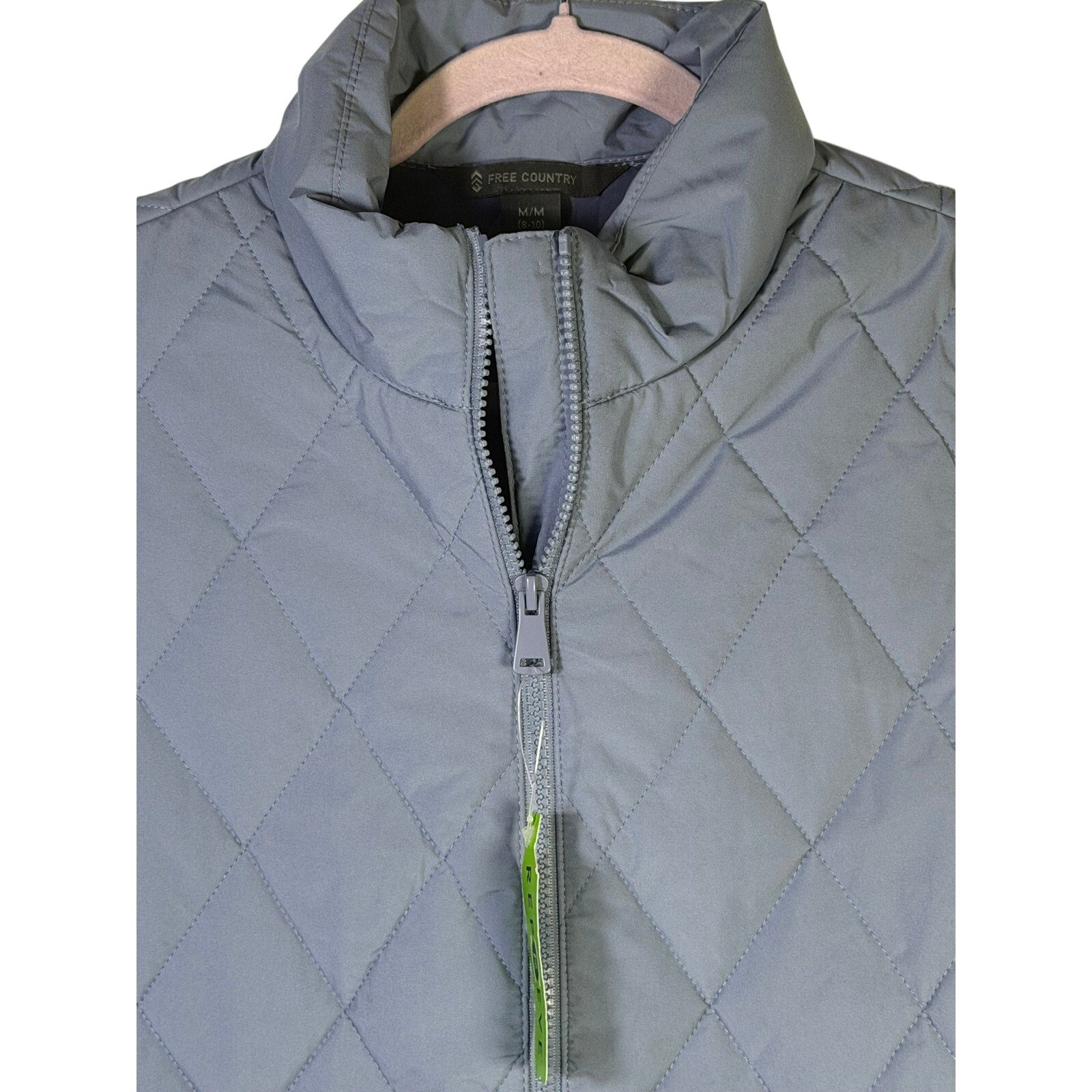 Free Country women's FreeCycle quilted vest in stonewash blue, size M, showing front view with quilted pattern and collar.