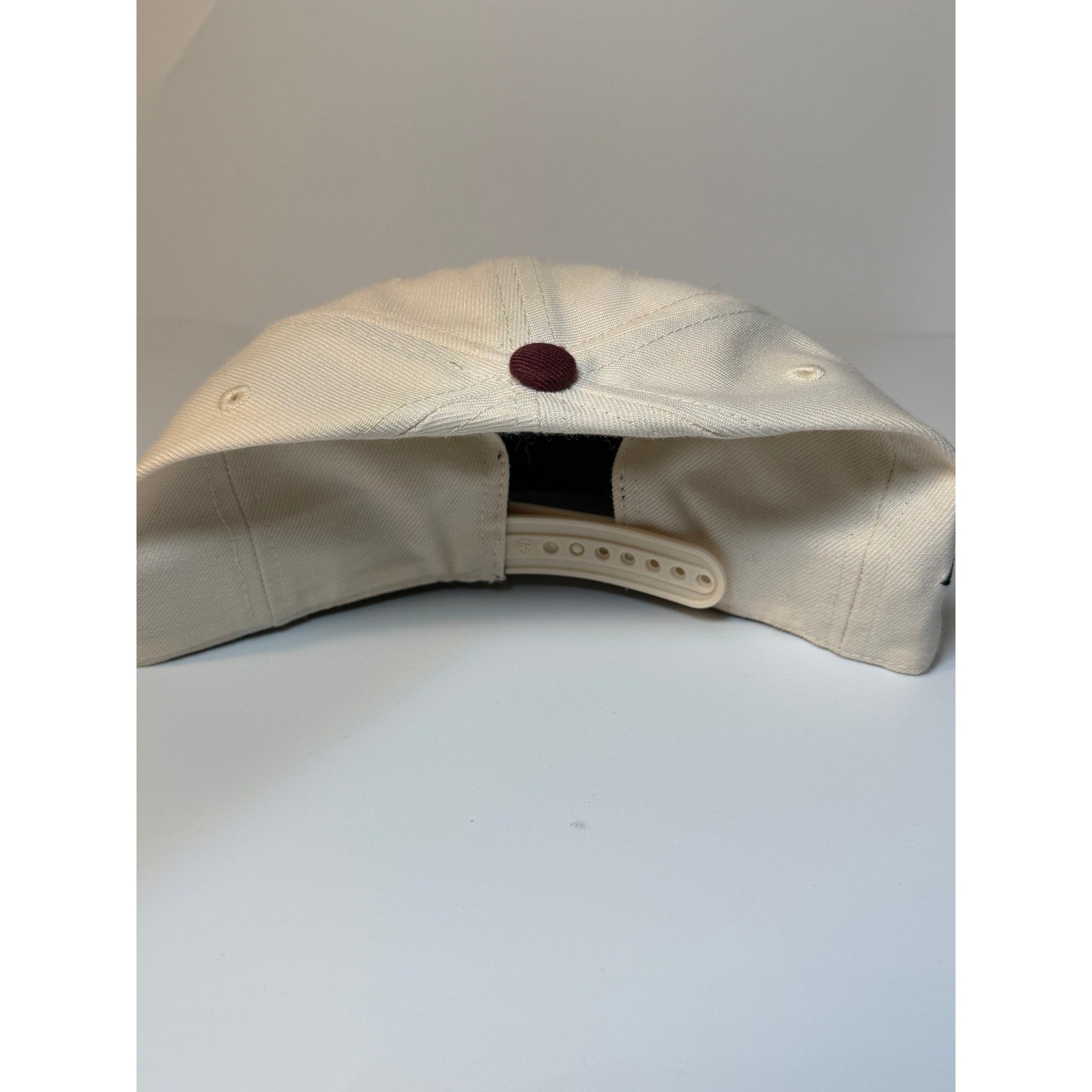47 Brand Texas A&M Aggies snapback hat in cream and maroon with adjustable strap, featuring team logo on front.