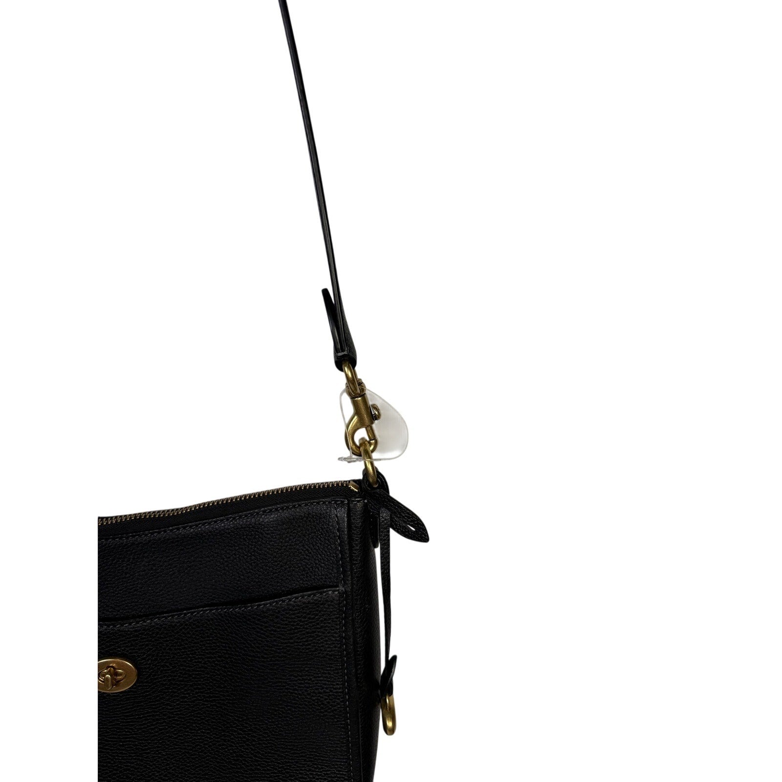Coach women's black pebbled leather crossbody handbag with gold-tone hardware, featuring a compact shoulder bag design.