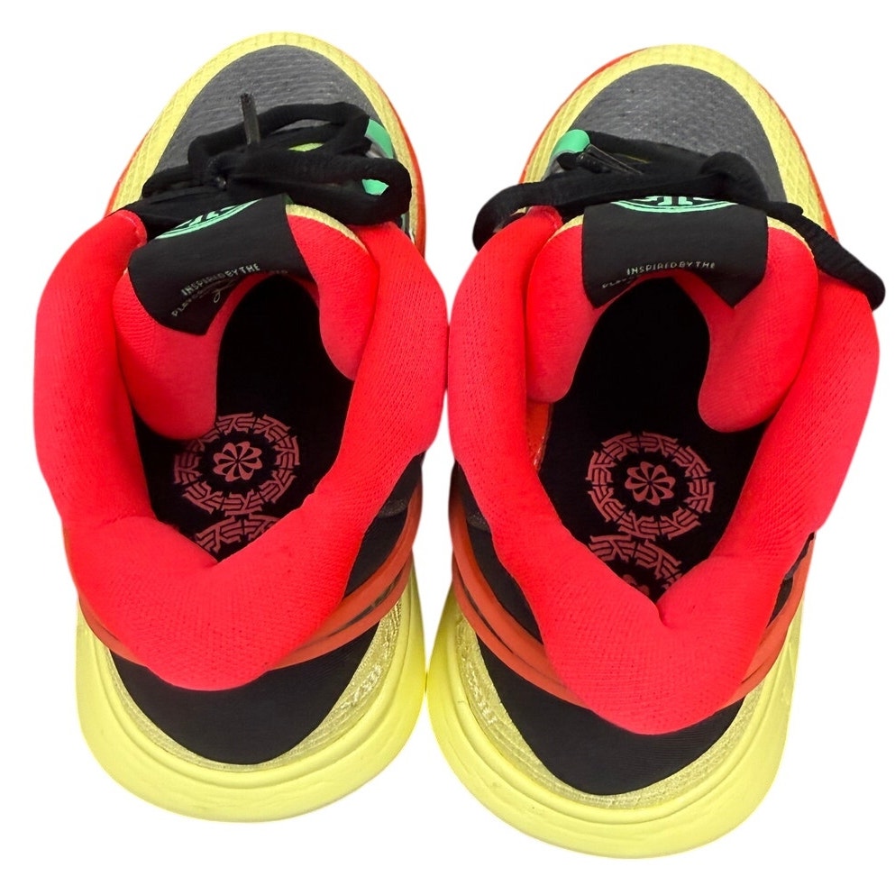 Nike Kyrie 8 GO basketball shoes for grade school in black and lemon chiffon, new in box, with Nike branding and sporty design.