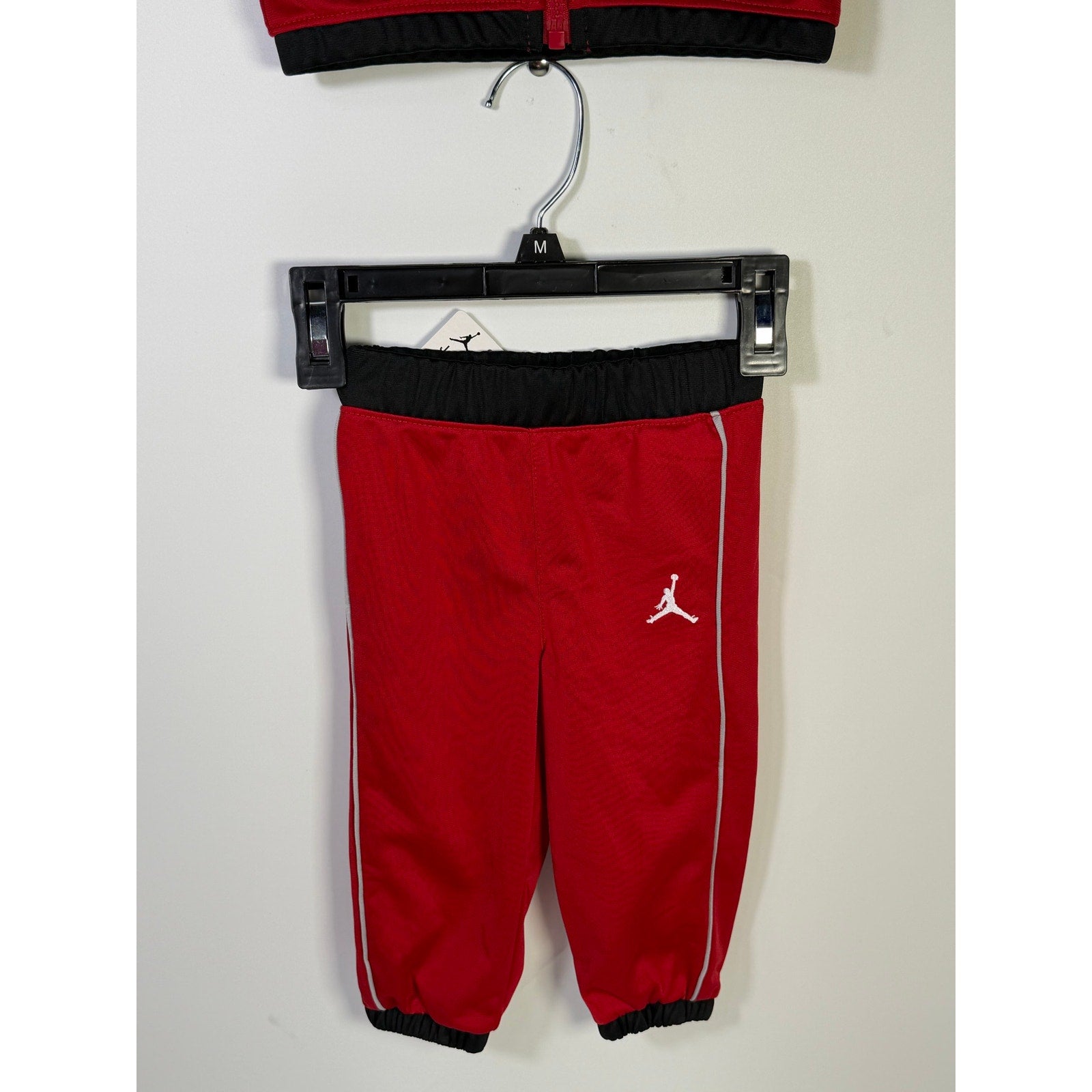 Jordan baby boys 2-piece tracksuit jacket and pants in red and black, size 12 months, new with tags.