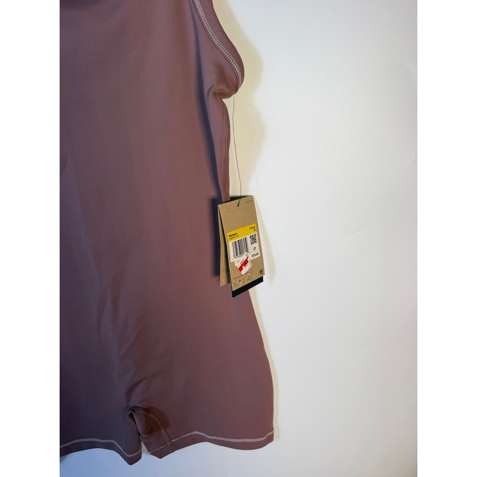 Nike women's mauve training one-piece bodysuit romper, size small, showing front view with fitted design and athletic style.