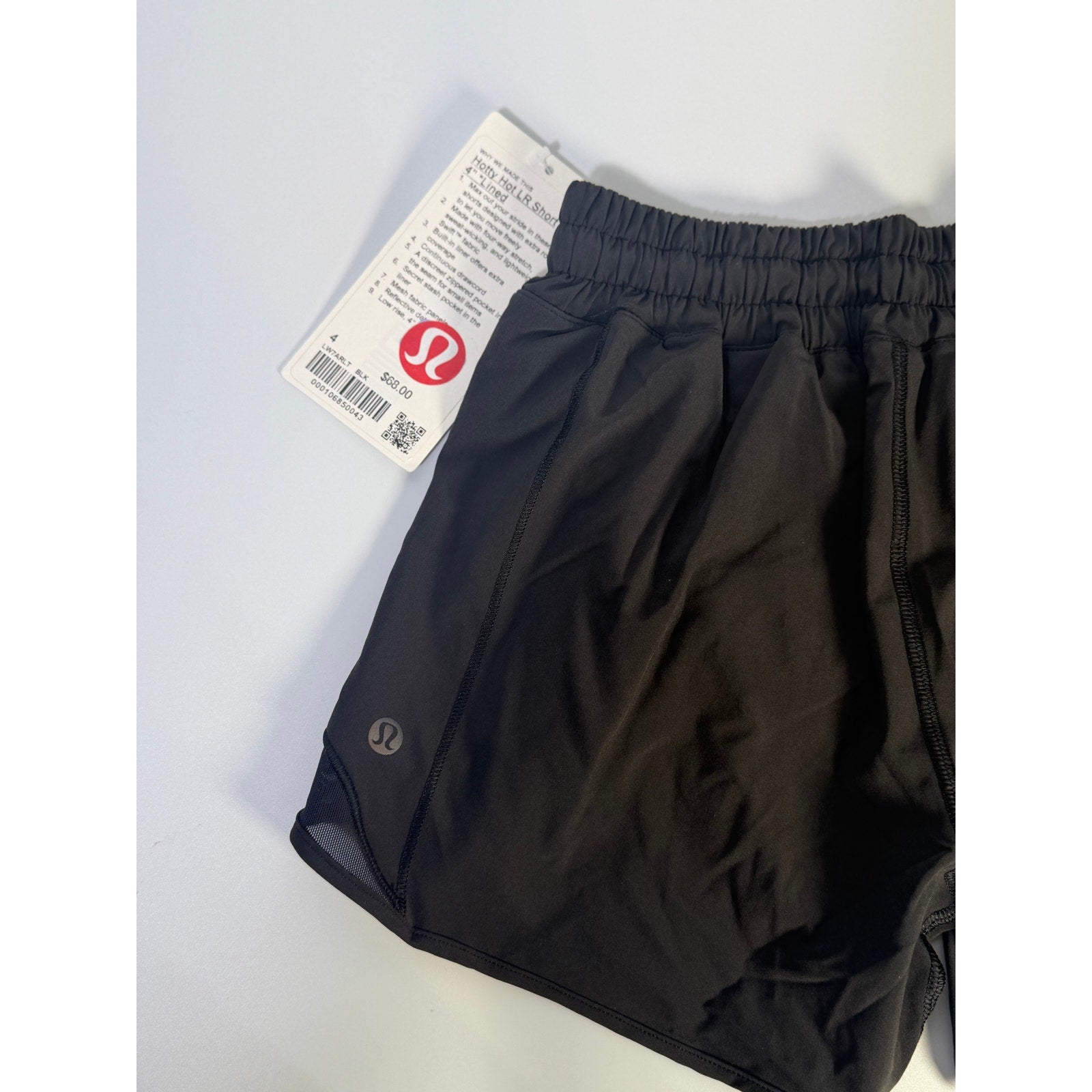 Lululemon Hotty Hot Low Rise Lined Shorts in black, women's size 4, showing the 4-inch inseam and lightweight fabric.