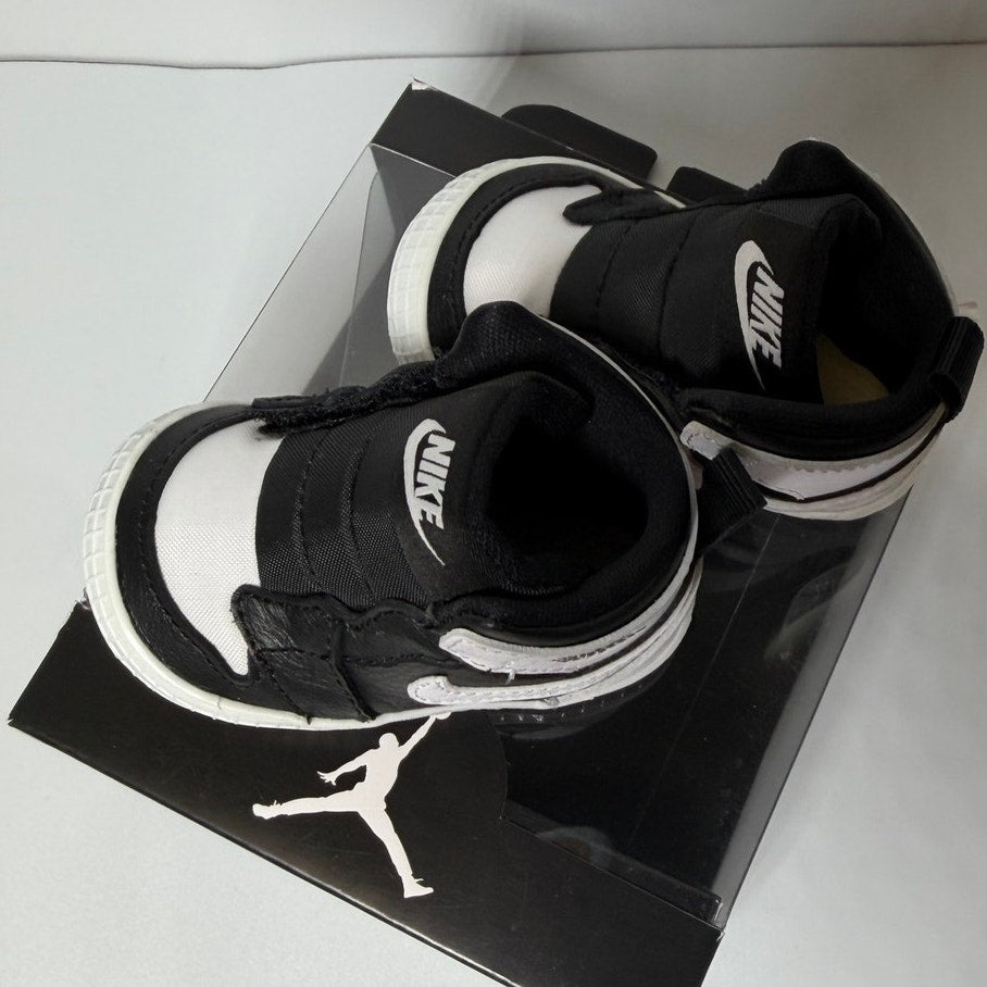 Nike Air Jordan 1 Retro High OG infant sneakers in black and white, designed for infants size 2C.