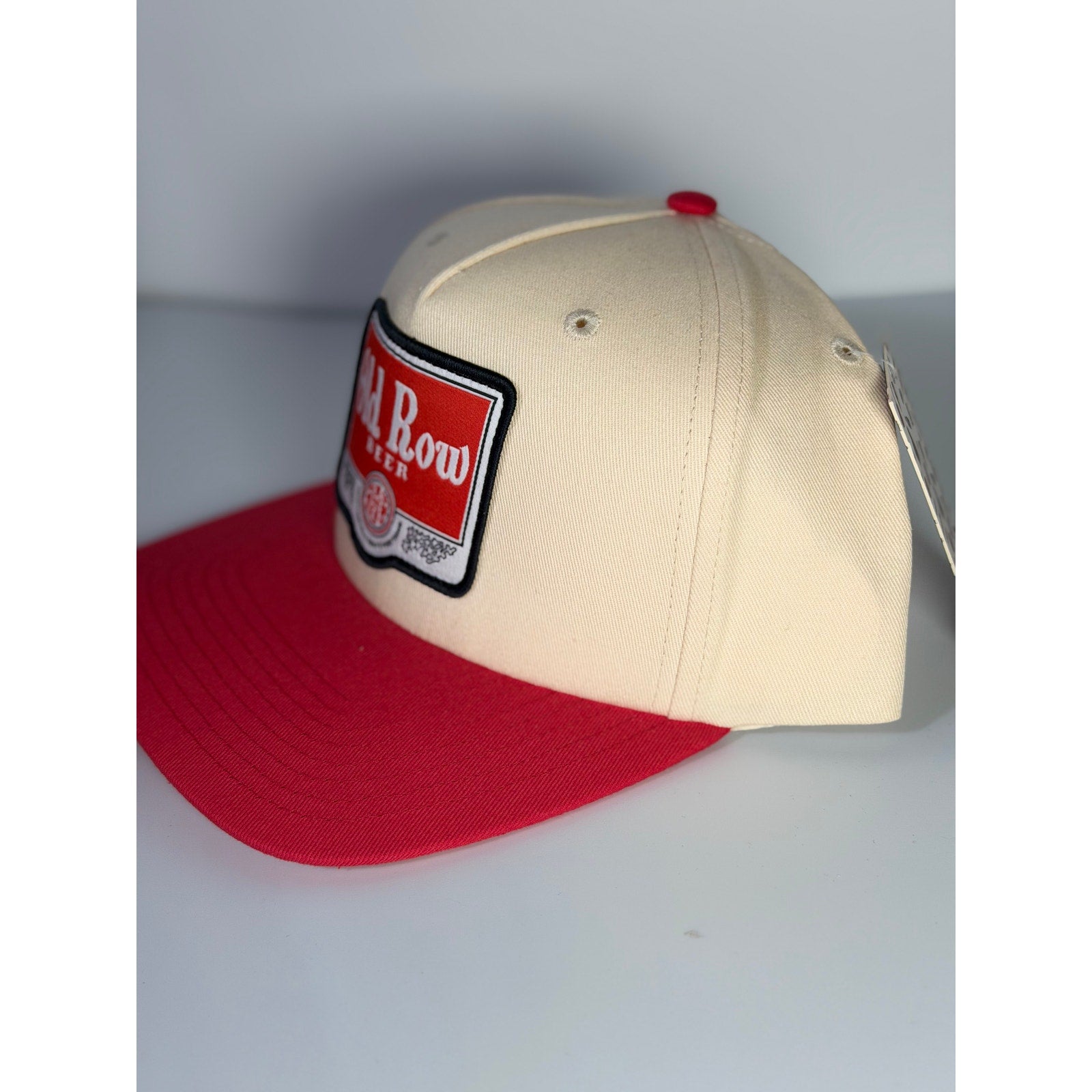 Old Row baseball cap in red and cream, adult snapback hat with Old Row branding and classic design.