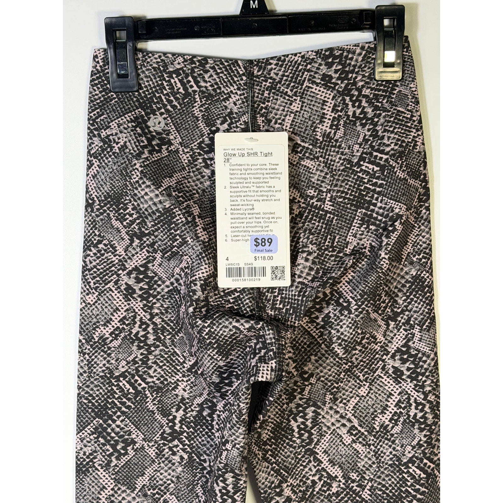Lululemon Glow Up SHR Tight leggings, size 4, in pink and black snakeskin pattern, featuring 28-inch length and snug fit