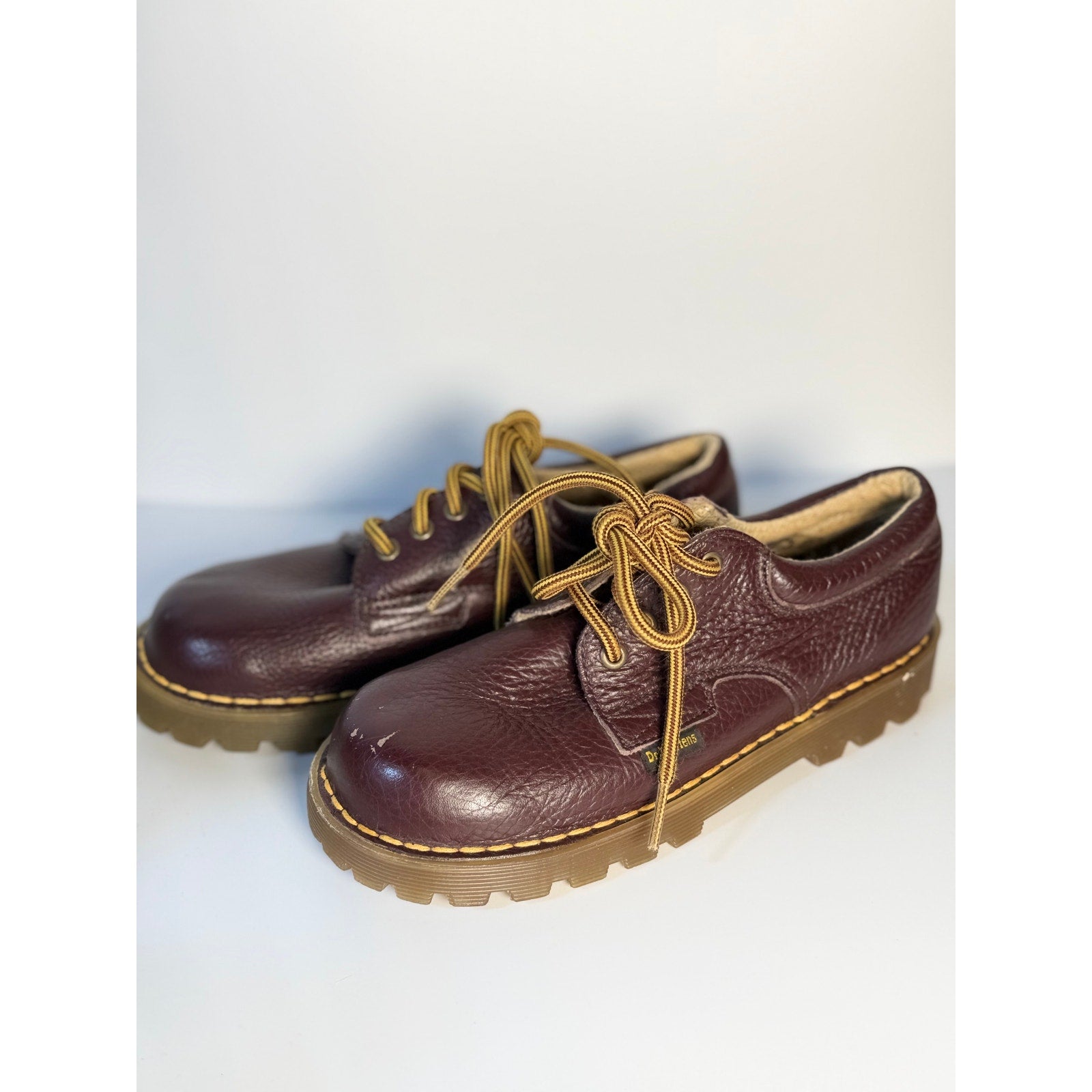 Dr. Martens 3-Eye Oxford boots in oxblood leather, UK 5, featuring classic lace-up design and sturdy sole.