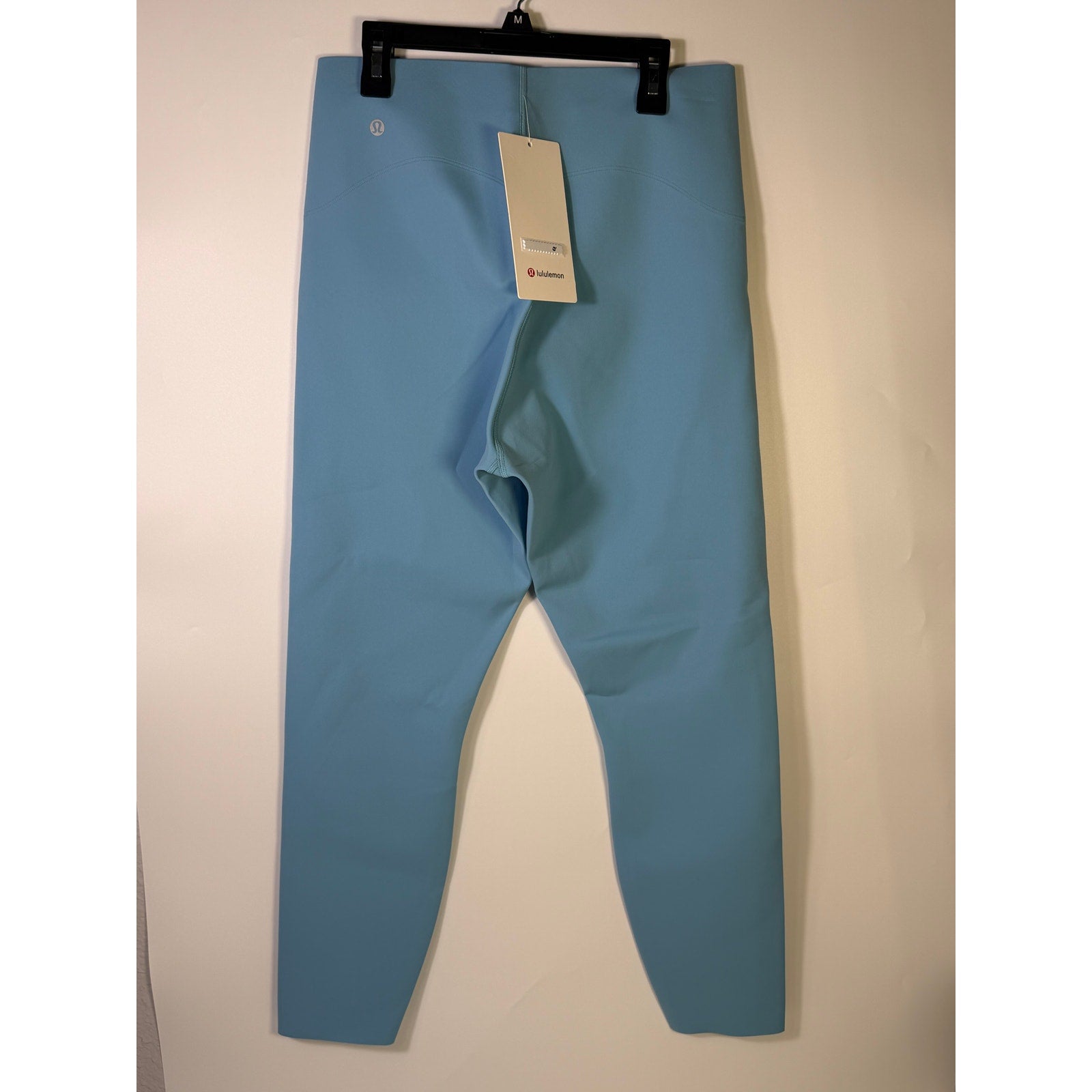 Lululemon Glow Up HR Tight 25-inch women's leggings in Windmill Blue, showing close-up of fitted, stretchy athletic leggings.