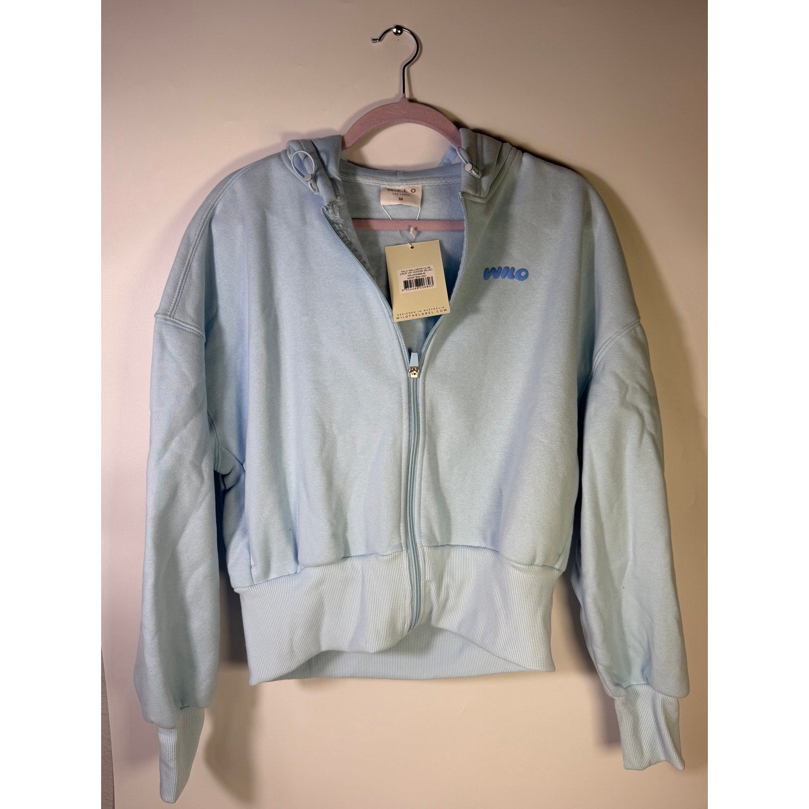 Blue Wilo The Label Wellness Club crop zip hoodie for women, size M, featuring a front zipper and casual fit.