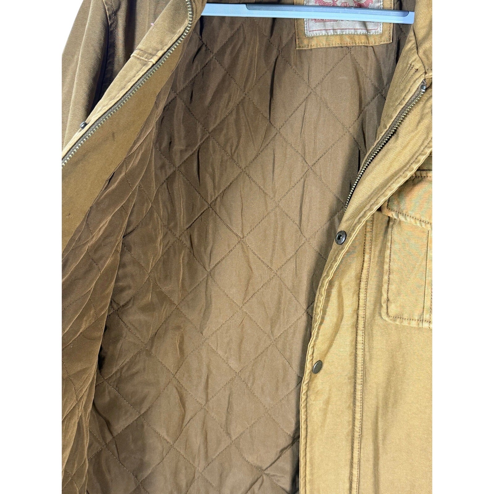 Levi’s men’s tan canvas quilted utility field jacket, size medium, showing front view with quilted design and utility pockets.