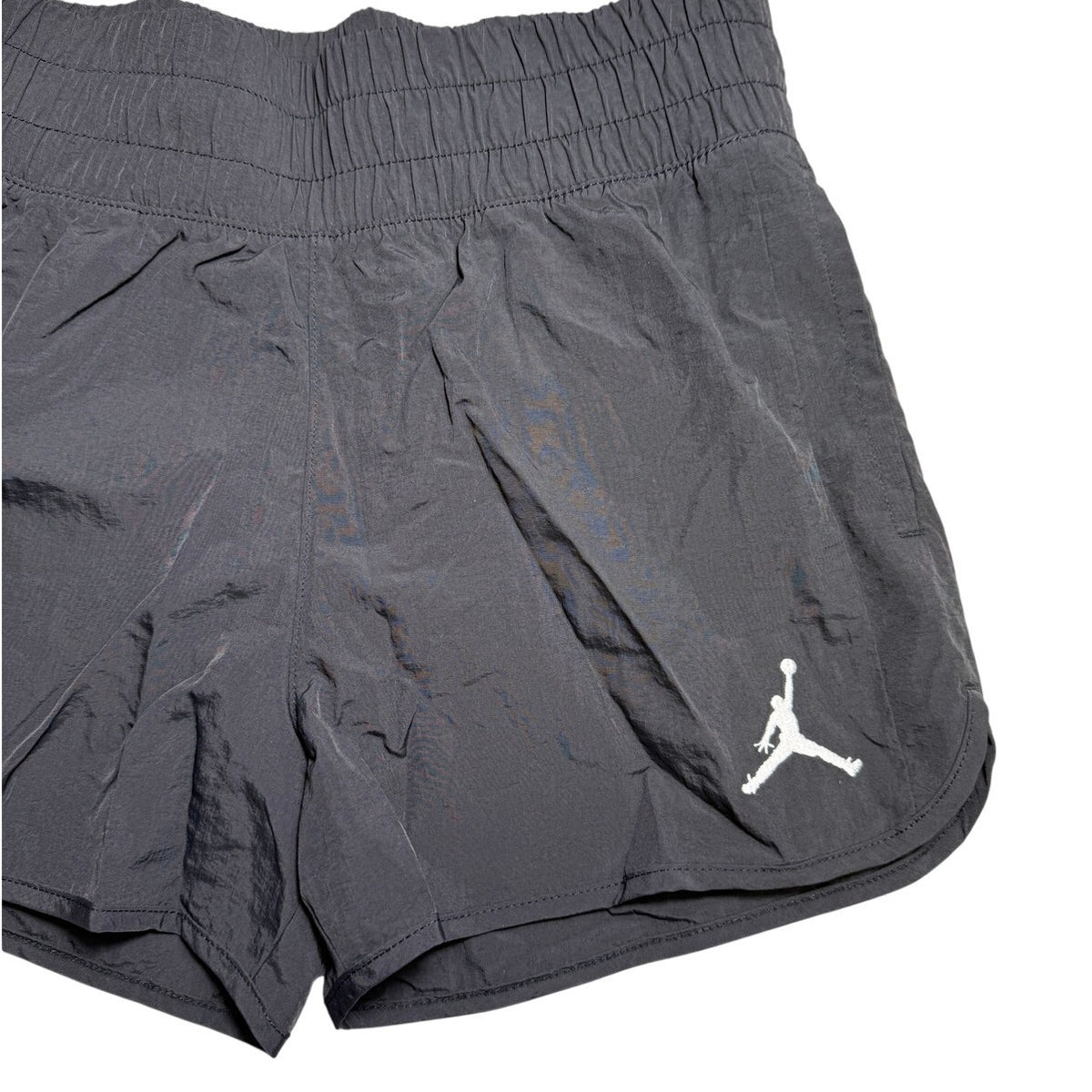 Jordan youth girls' large black shorts with Nike logo, featuring elastic waistband and casual athletic style.