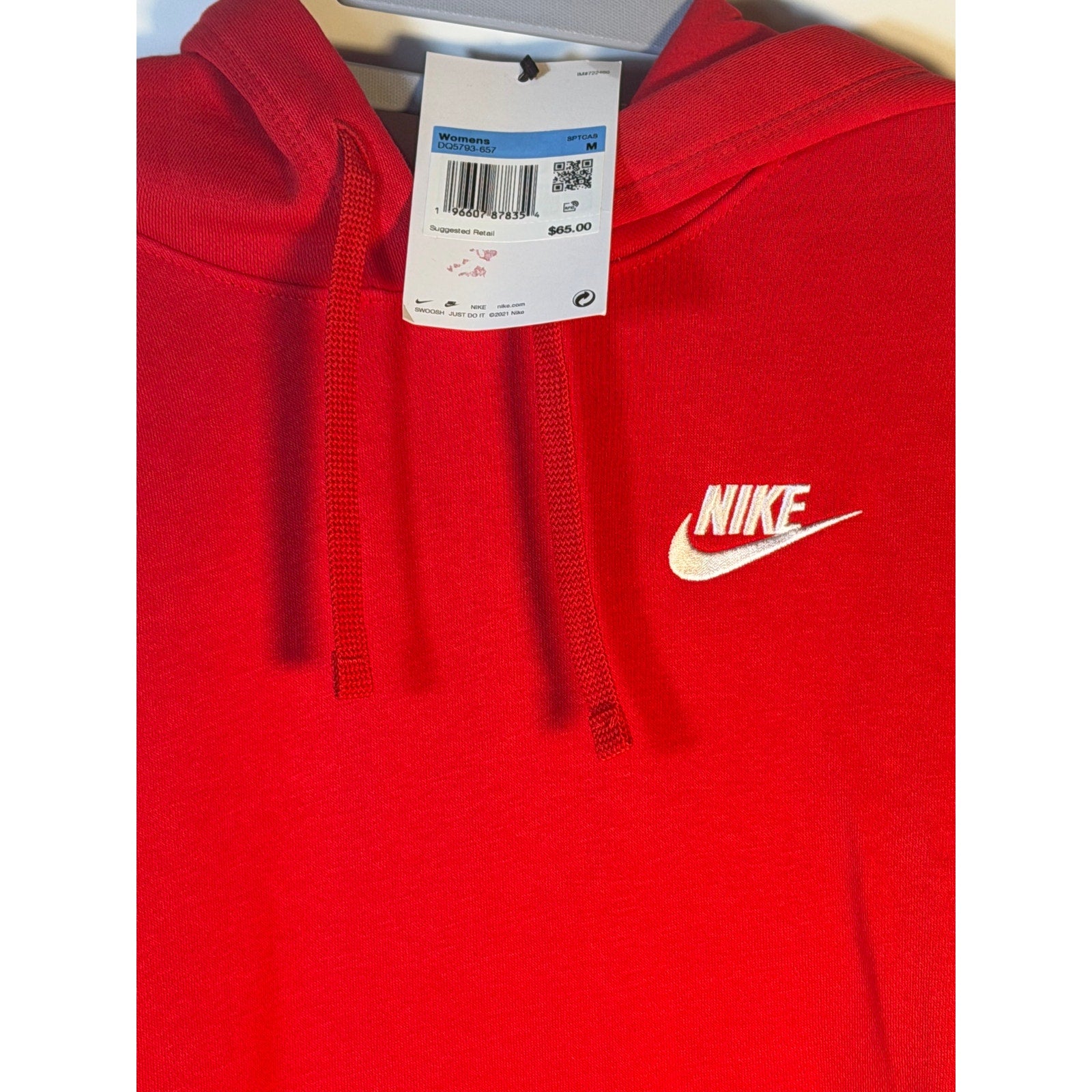 Red Nike Sportswear Club Fleece hoodie for women, medium size, soft cotton sweatshirt with a hood and long sleeves.