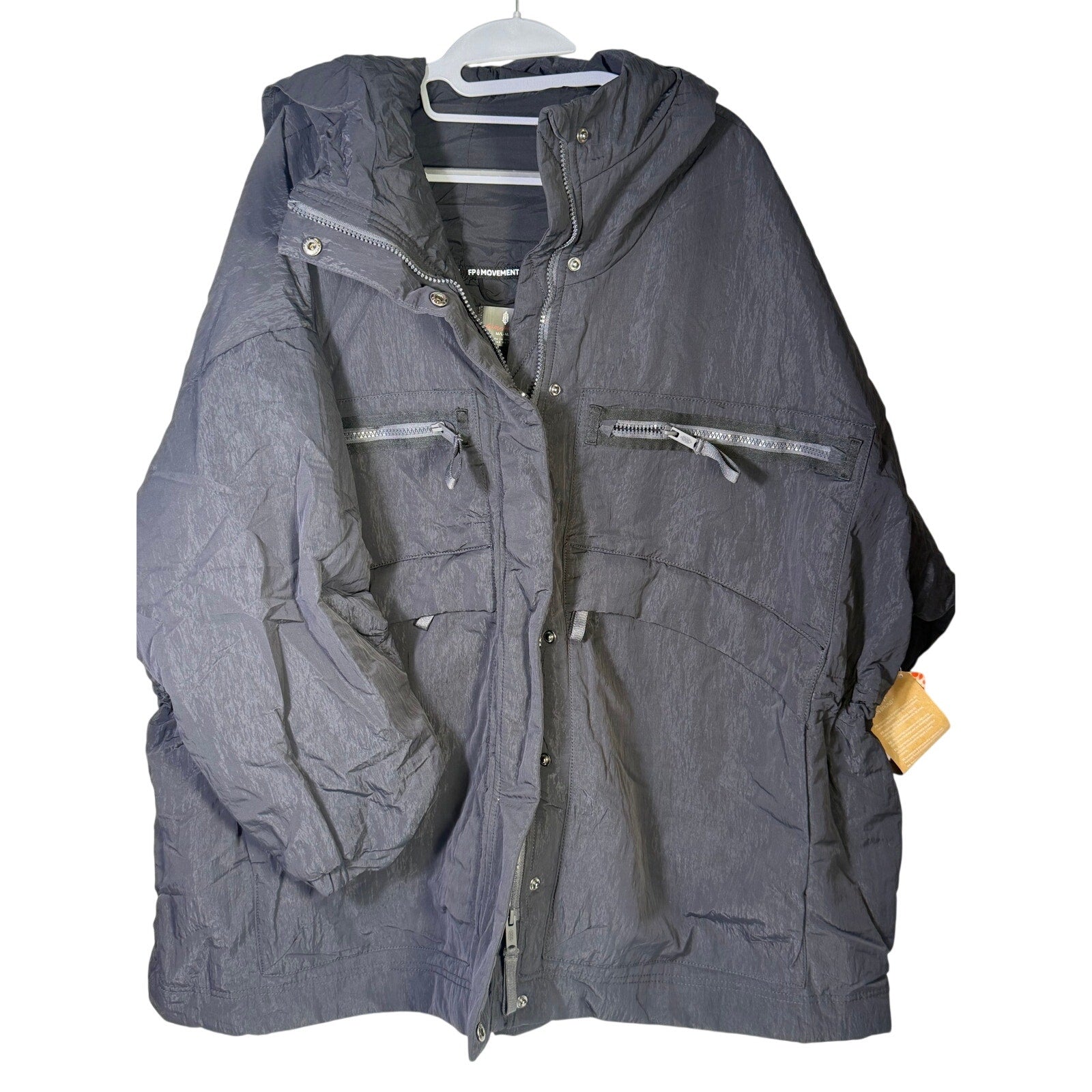 Black hooded utility jacket for women by Free People, featuring a hood and functional design, shown in the product image.