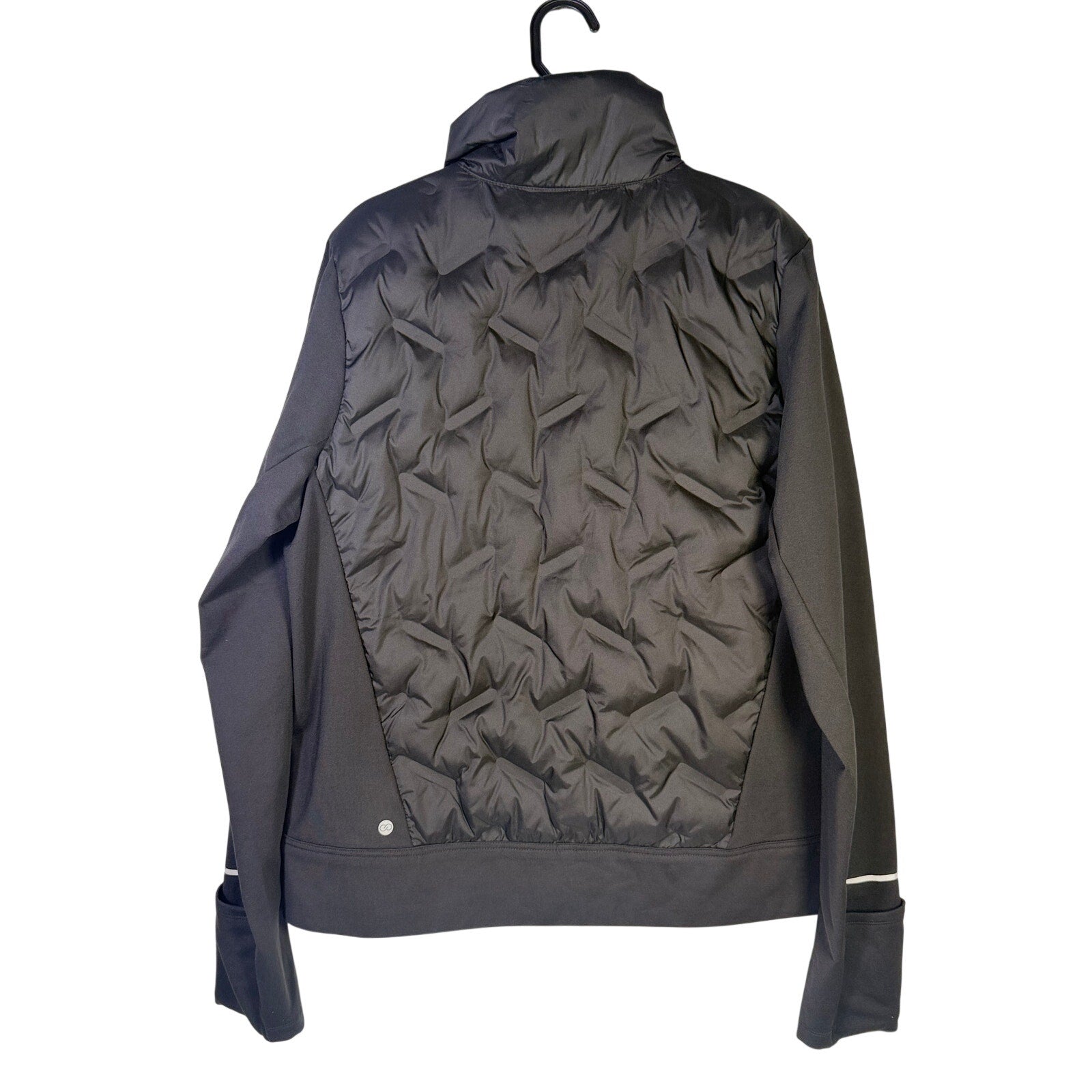 CALIA Women's Cold Dash Run Jacket in pure black, size medium, shown with quilted design and sporty fit.