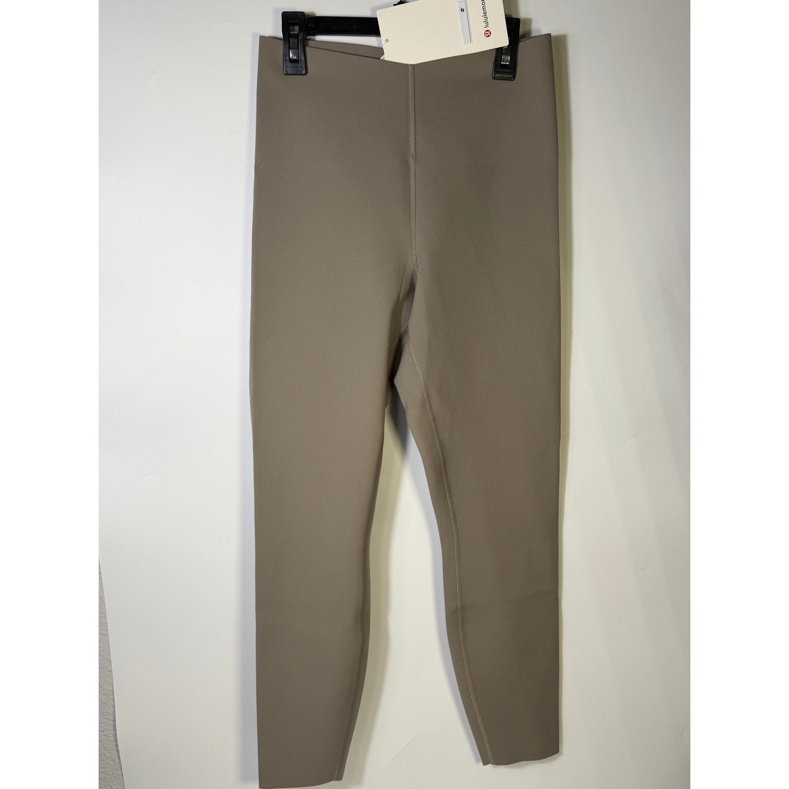 Lululemon Glow Up super-high-rise gray leggings in size 8, featuring a snug fit and 25-inch length, new with tags.