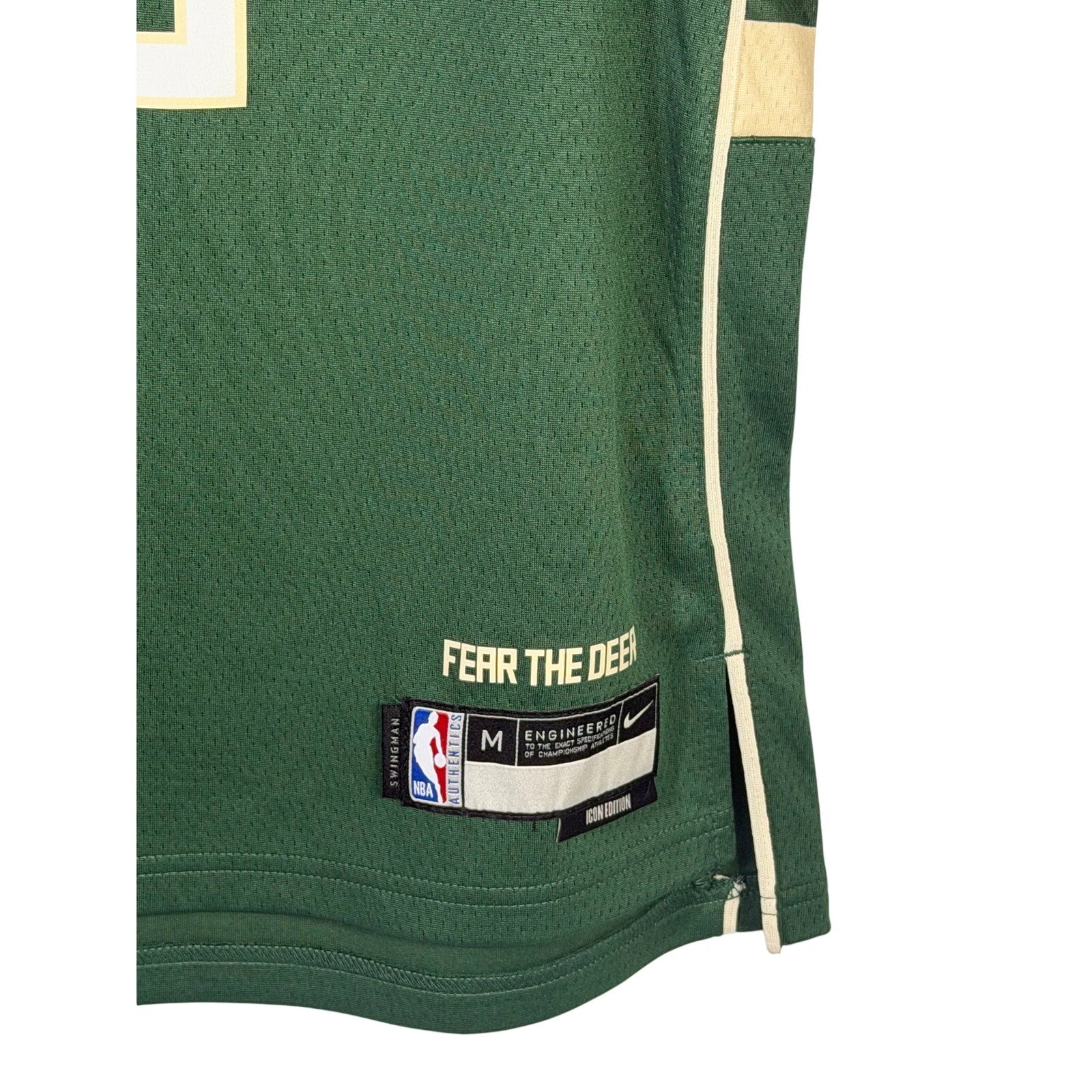 Nike Milwaukee Bucks Damian Lillard #0 youth swingman jersey in green, size M 10-12, with team logo and player number visible.