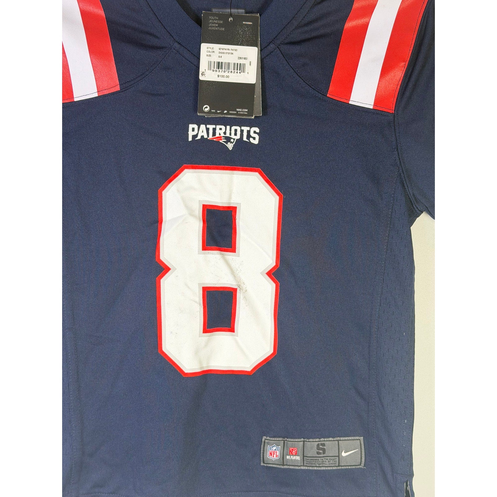 Nike youth New England Patriots Stefon Diggs #8 game jersey in navy, size small, featuring team logos and player details.