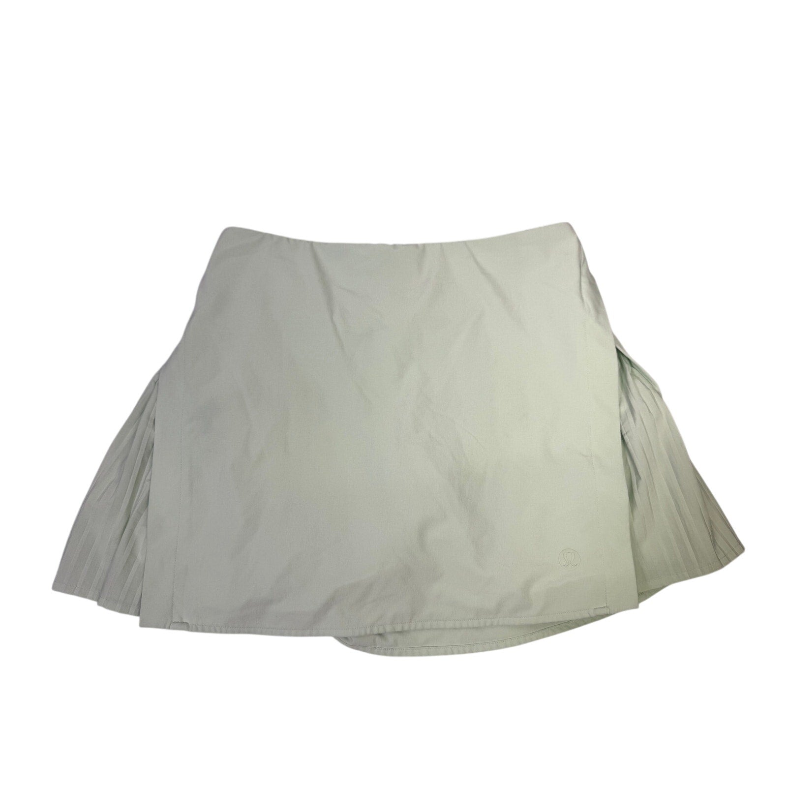 Lululemon women's light mint pleated tennis skort with built-in shorts, size 6, featuring a sporty and stylish design.