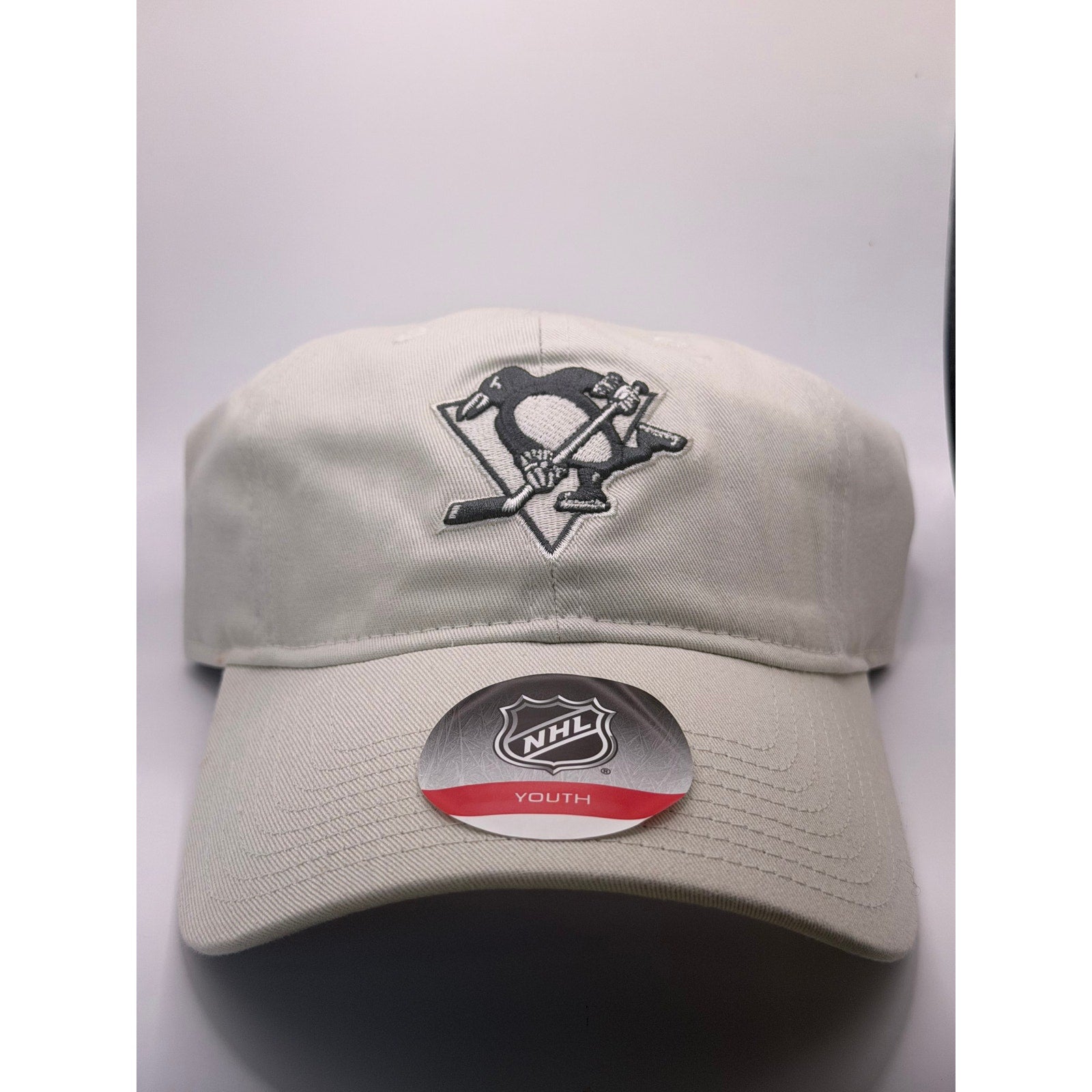 NHL Pittsburgh Penguins youth adjustable strapback hat in beige with team logo, one size fits most, new with tags.