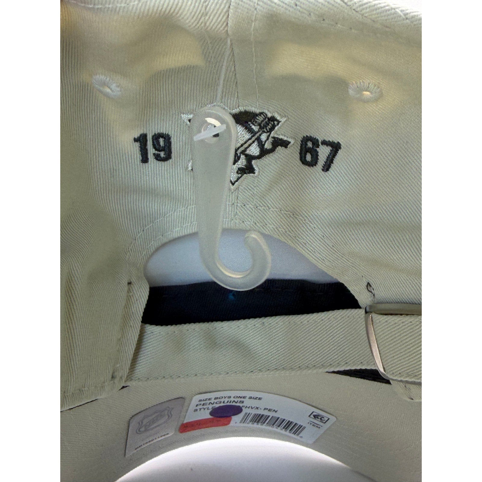 NHL Pittsburgh Penguins youth adjustable strapback hat in beige with team logo, one size fits most.