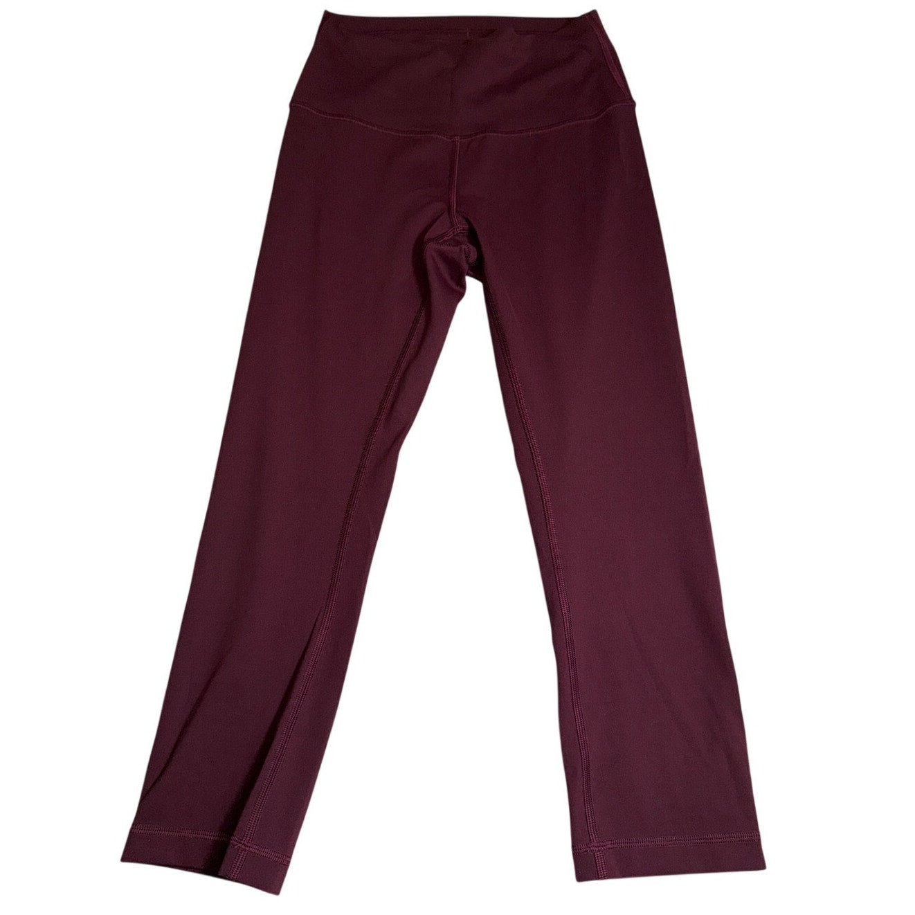 Lululemon women's burgundy high-rise flared yoga leggings, size 6, shown on a model with a close-up of the fabric and fit.