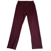 Lululemon women's burgundy high-rise flared yoga leggings, size 6, shown on a model with a close-up of the fabric and fit.