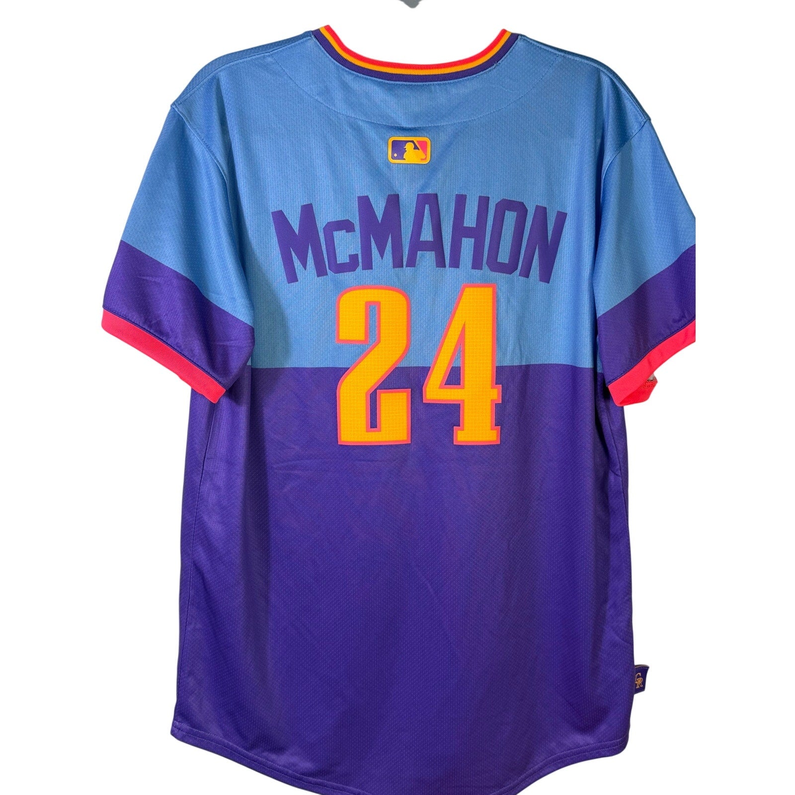 Nike Rockies McMahon #24 City Connect youth jersey, size L 14/16, with team logo and vibrant design, brand name visible.
