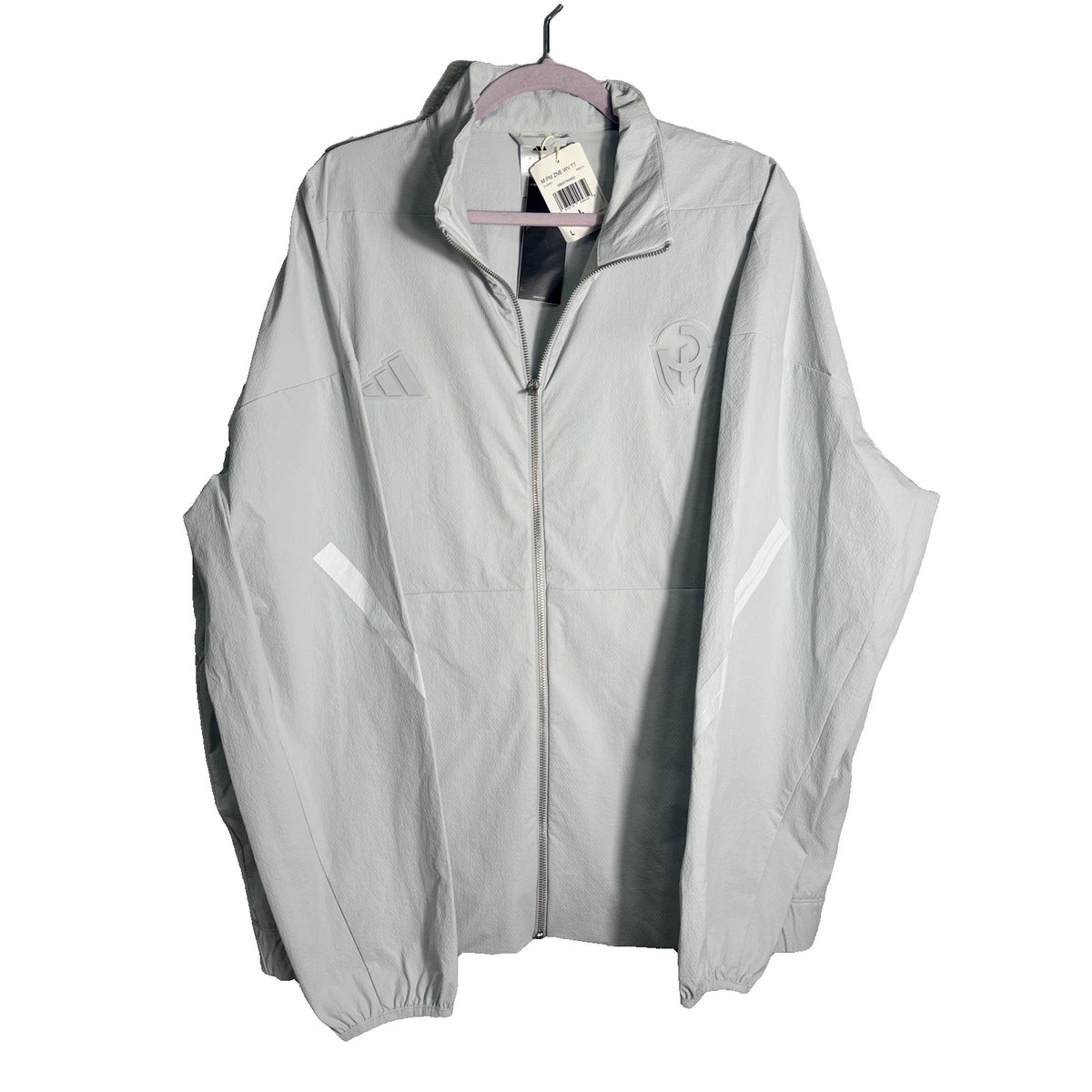 Men's adidas Patrick Mahomes Z.N.E. woven track jacket in clear grey, lightweight fabric with zip closure and sporty design.