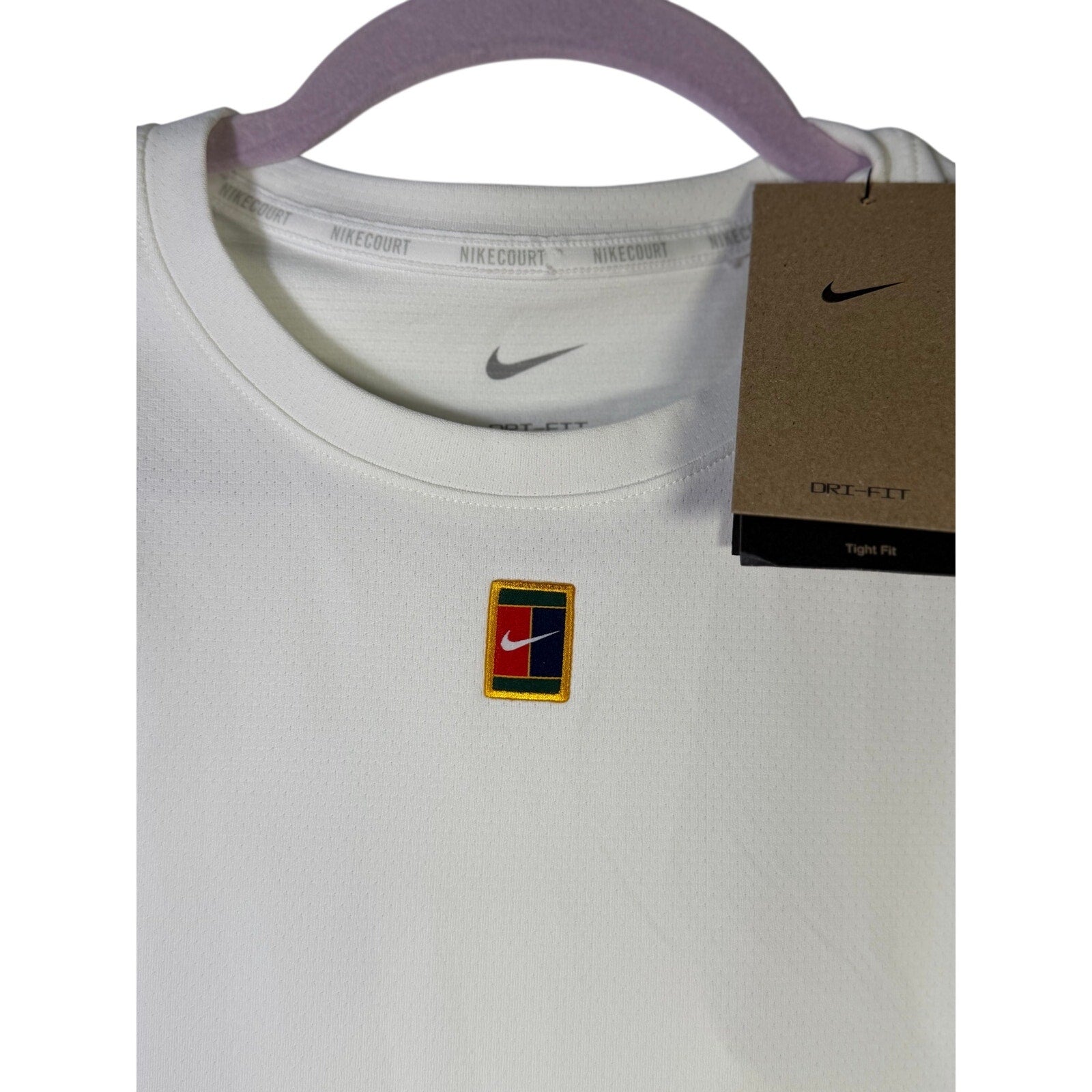 NikeCourt women's white tennis tank top, size XL, lightweight and breathable athletic top for women.