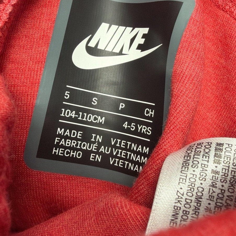 Red Nike kids' tech fleece jogger pants for ages 4-5 years, showing elastic waistband and relaxed fit, size 5, 104–110 cm.