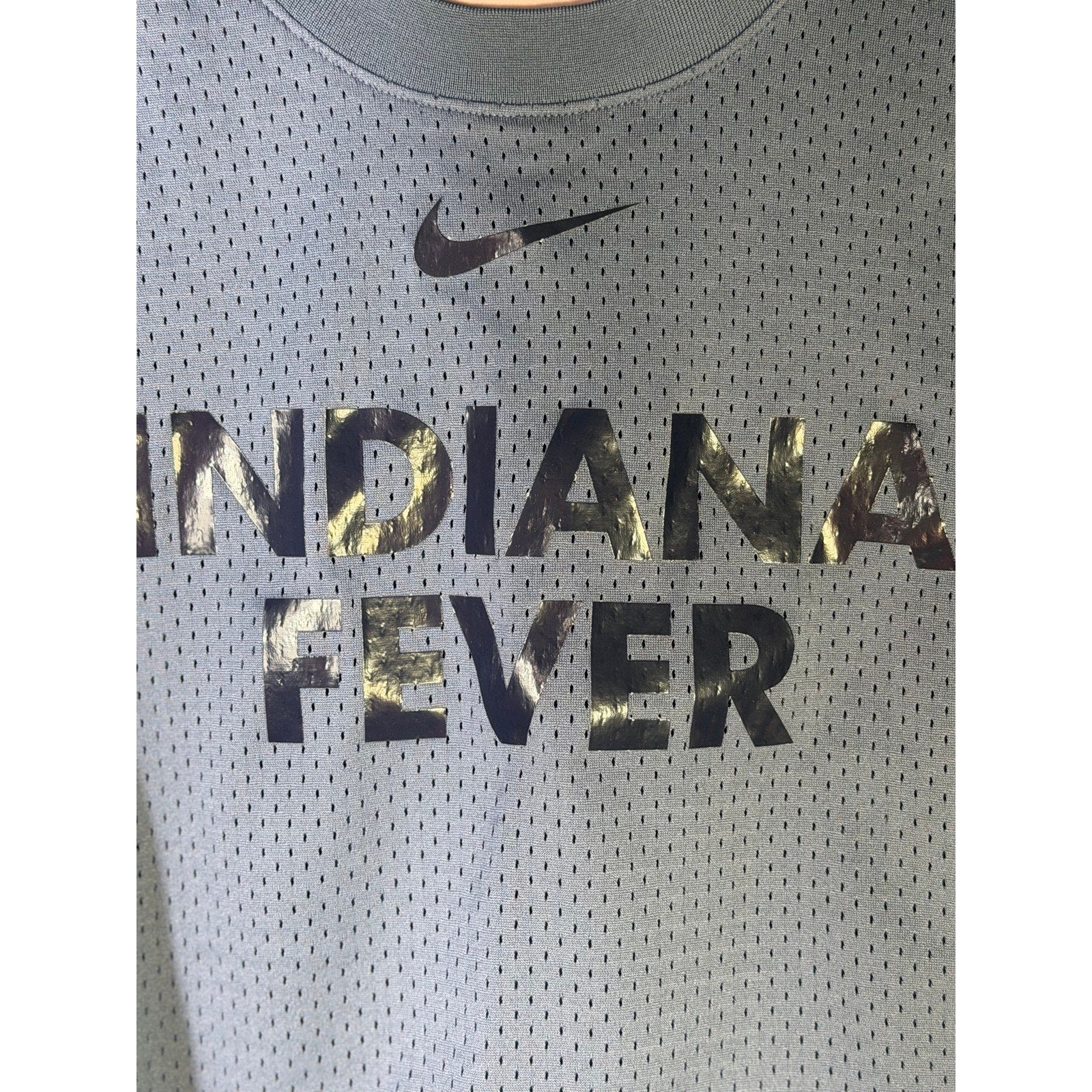 Nike WNBA Indiana Fever women's blue mesh basketball tank top, size L, front view showing team logo and breathable fabric.