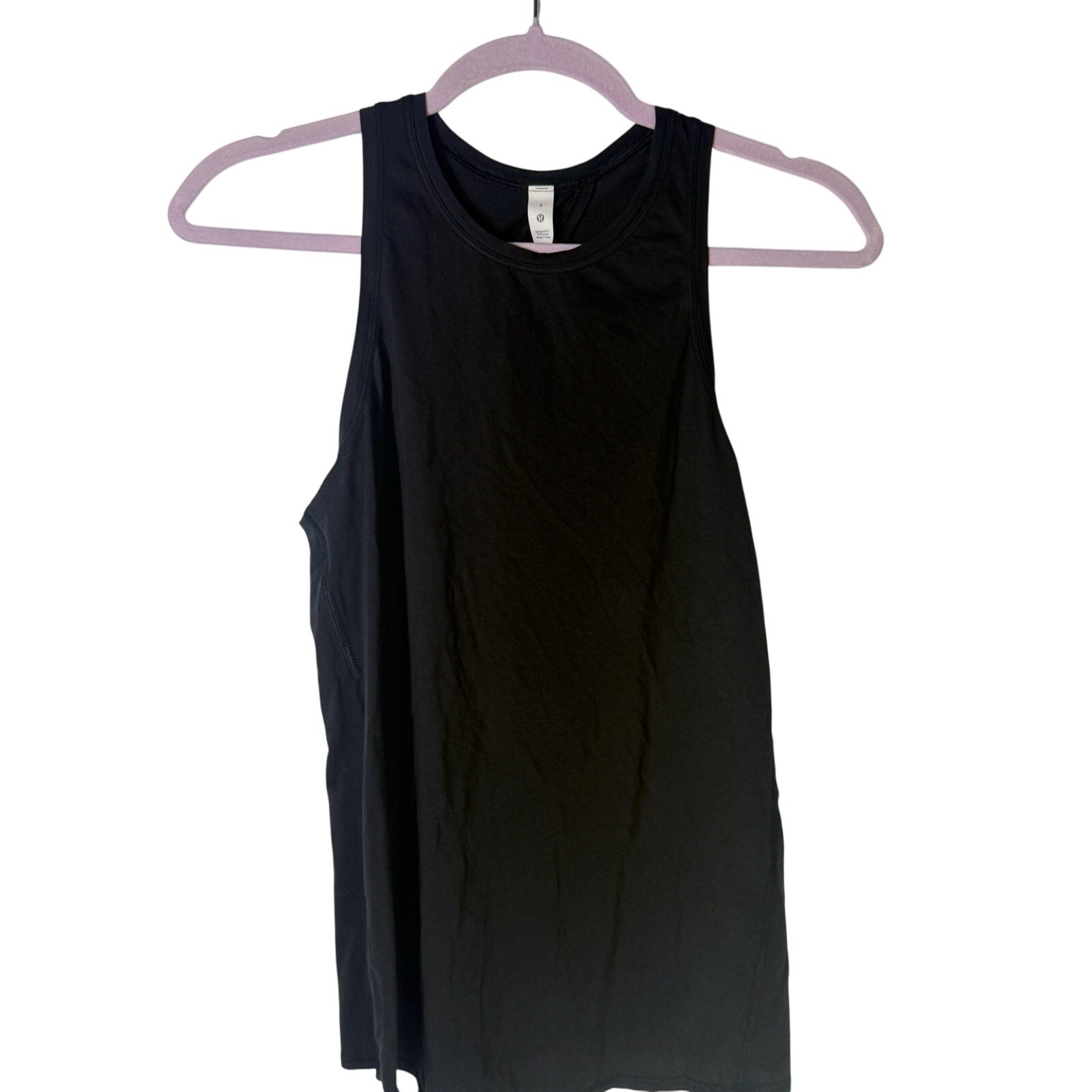 Black Lululemon women's high-neck open-back athletic tank top, size 4, shown on a hanger with a fitted design.