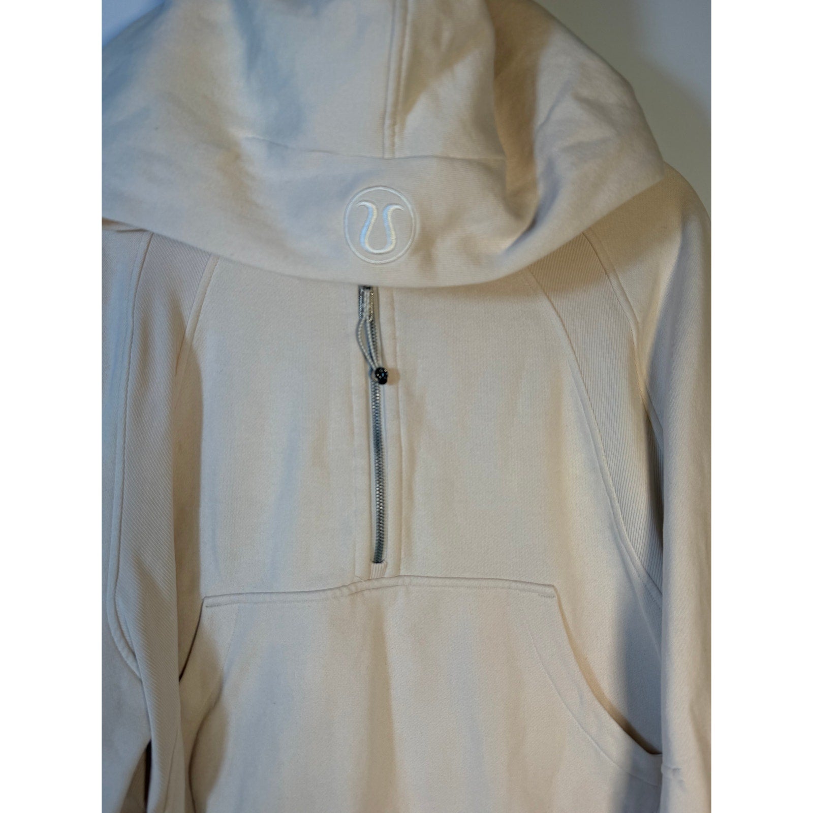 Cream Lululemon Scuba Half Zip Hoodie for women, oversized pullover in XL/XXL, featuring a relaxed fit and zip-up neckline.