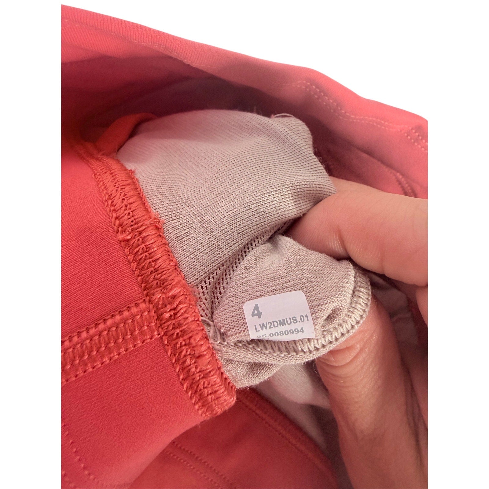 Lululemon women's coral red strappy longline sports bra with adjustable straps, size 4, designed for active wear.