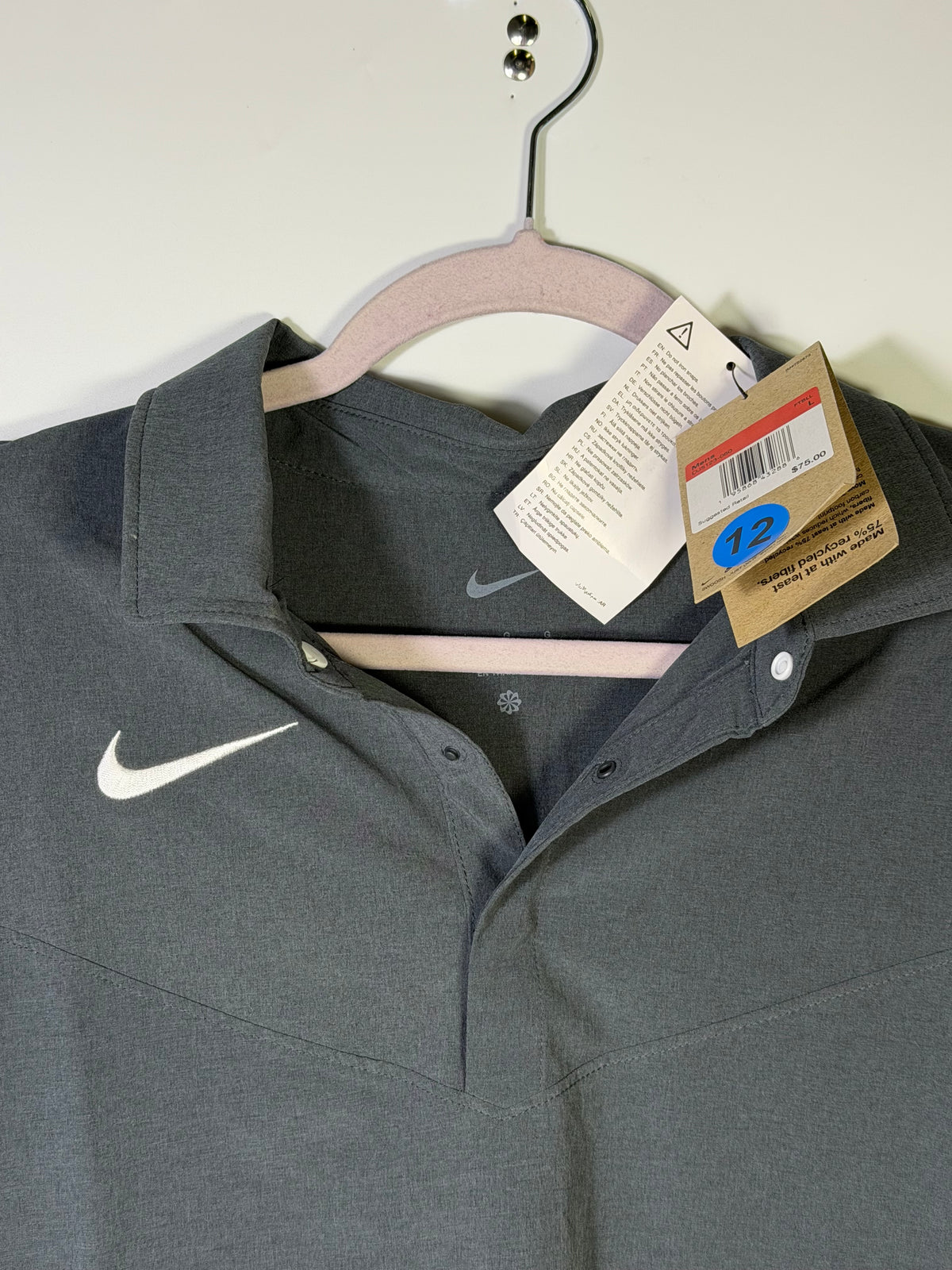 Men's Nike Dri-FIT Football Sideline Polo in gray, large size, showing the lightweight, breathable fabric and Nike logo detail.