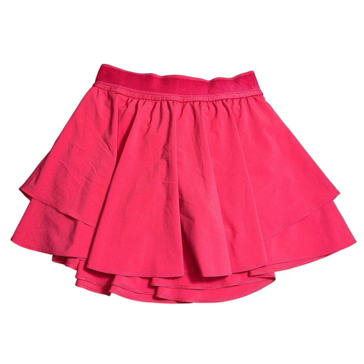 Lululemon Sonic Pink Ruffle Skort for women, size 6, with ruffled hem and athletic fabric, in great condition.