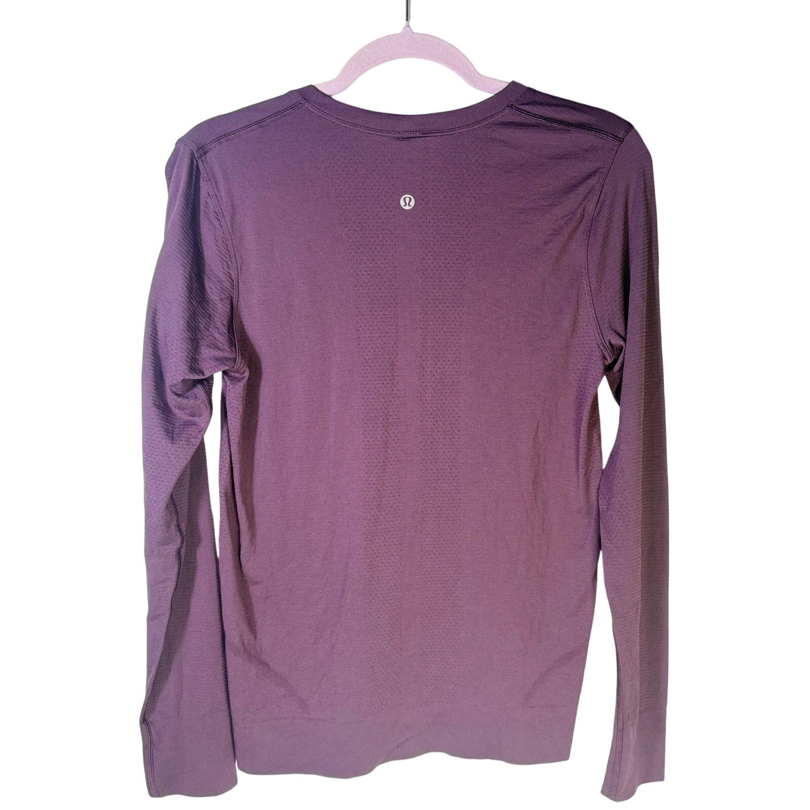 Purple Lululemon Women’s Swiftly Tech long-sleeve athletic shirt, size 6, with breathable fabric and fitted design.