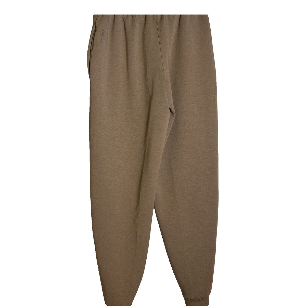 Nike 24.7 Dri-FIT women's jogger pants in tan taupe, lightweight, tapered fit, featuring elastic waistband and Nike logo detail.