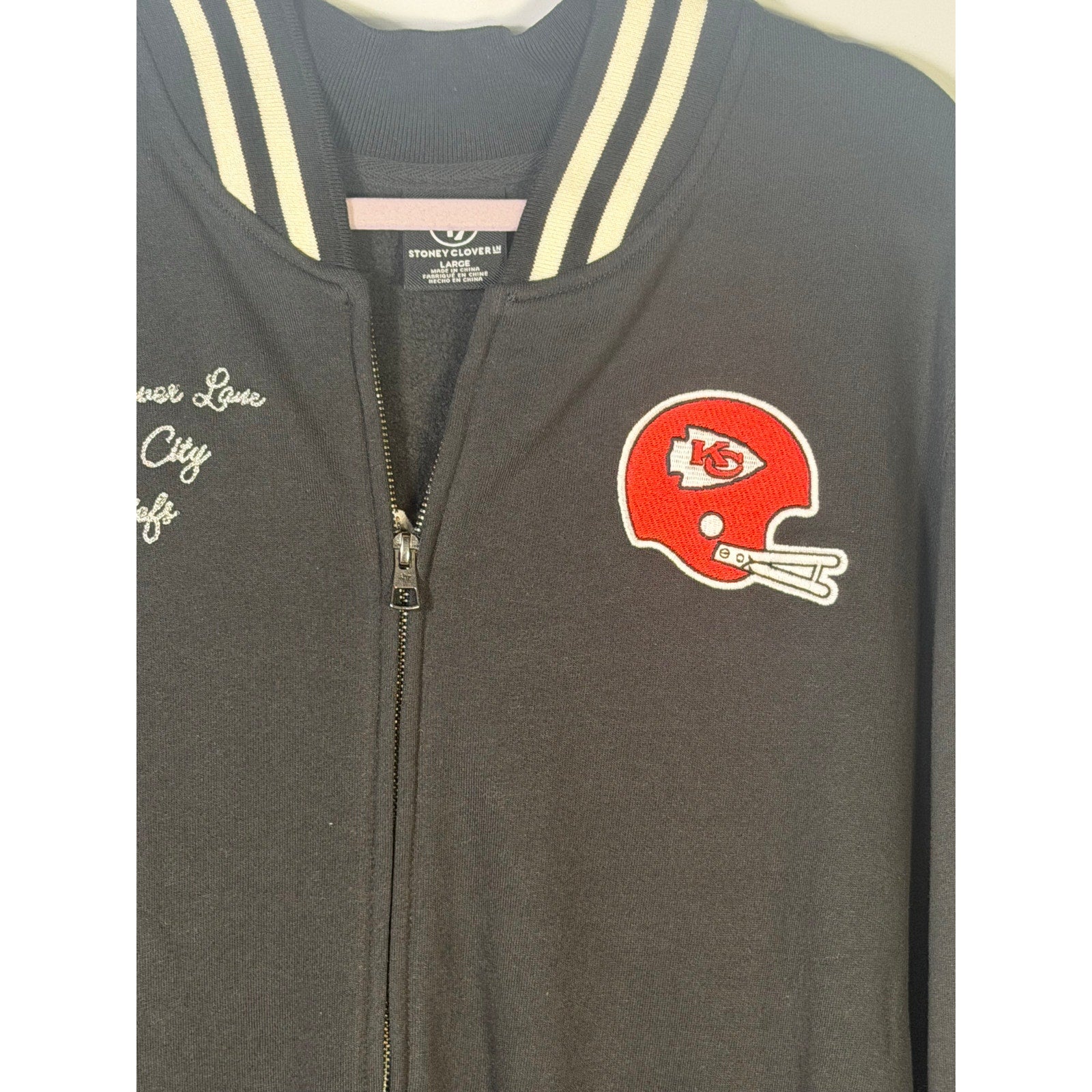 Stoney Clover Kansas City Chiefs women's varsity jacket in black, large size, featuring team logo and varsity-style design.
