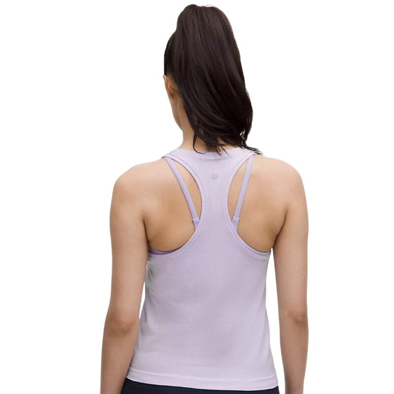 Lululemon Athletica Swiftly Tech Racerback Tank Top 2.0 in Lavender Frost, women's size 12, front view showing lightweight athletic top.