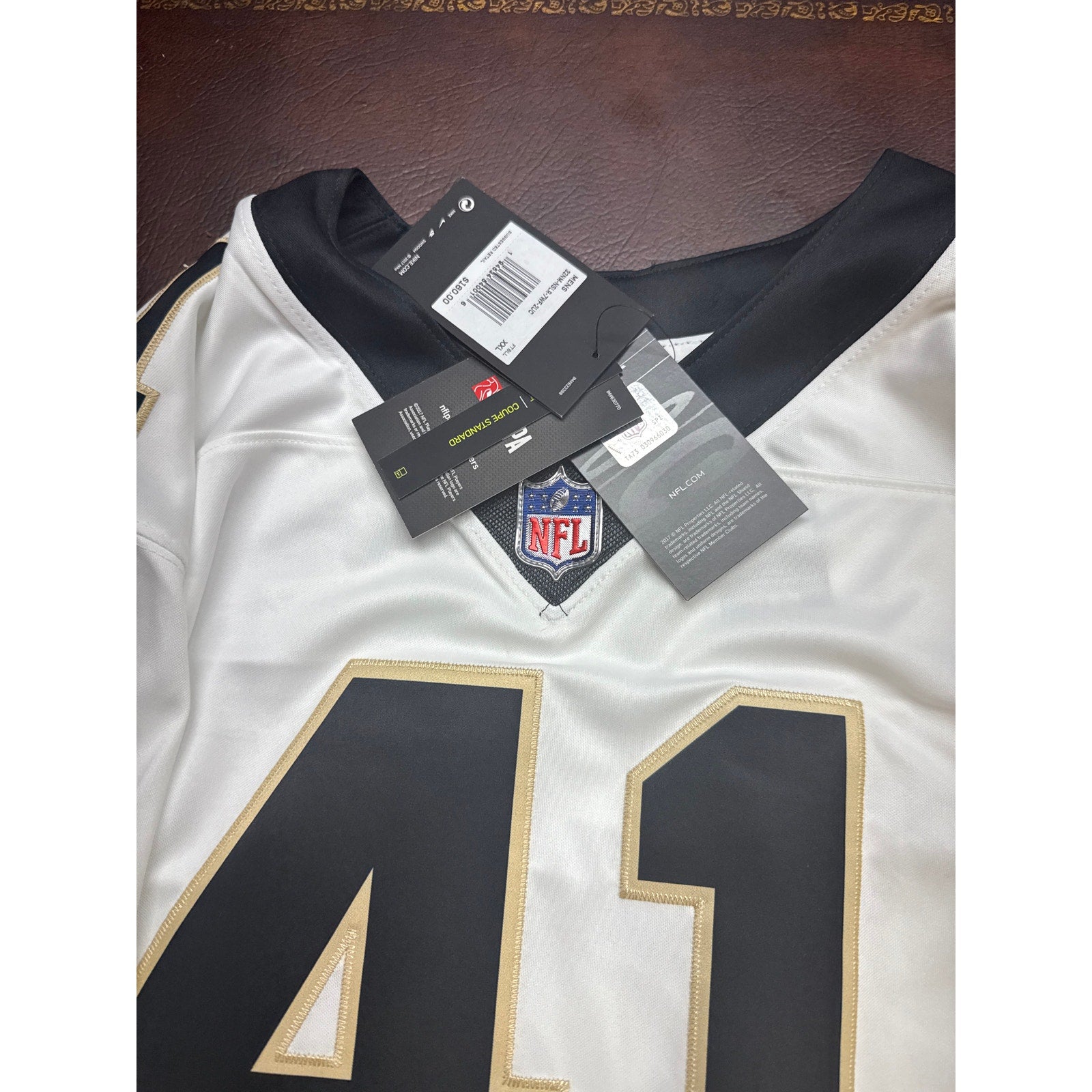 Nike New Orleans Saints #41 men's NFL game jersey in white, size 2XL, with tags attached, showing front view with team logo.