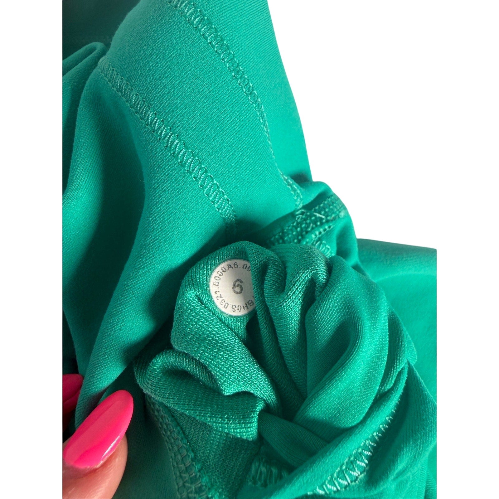 Lululemon women's teal green high-rise biker shorts, size 6, featuring a smooth stretch fabric and fitted design.