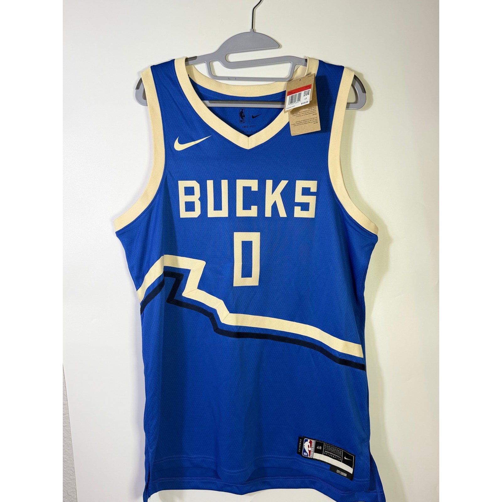 Nike Milwaukee Bucks Damian Lillard #0 City Edition men's swingman jersey, new with tags, shown in navy with team logo.