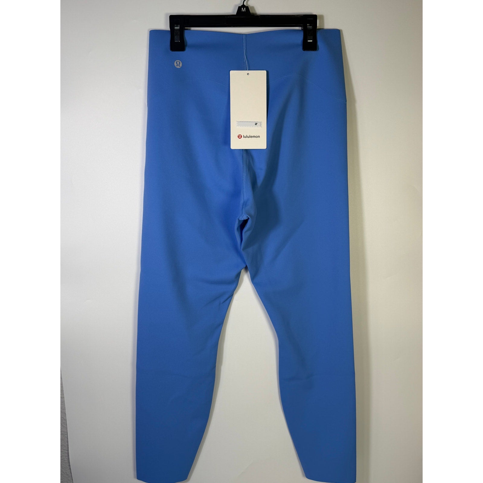 Lululemon Glow Up high-rise leggings in Pool Party Blue, size 14, with a snug fit and high waistband, new with tags.