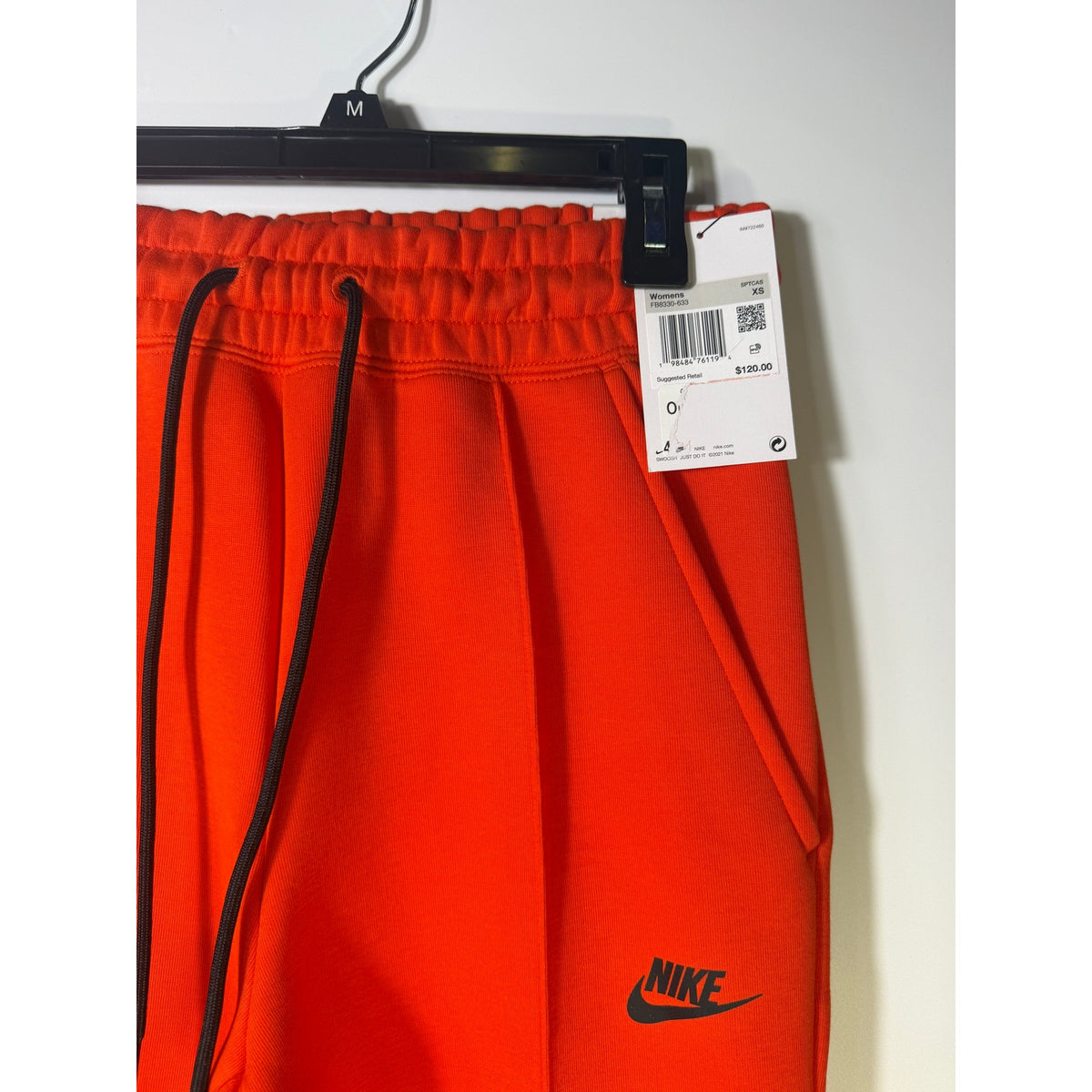 Bright orange Nike Sportswear Phoenix fleece jogger pants for women, mid-rise fit, size XS, with a relaxed, comfortable style.
